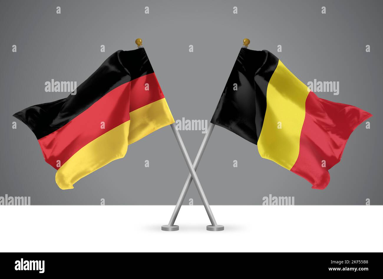 Zwei Wavy gekreuzt Flaggen von Deutschland und Belgien, Zeichen der deutschen und belgischen Beziehungen Stockfoto