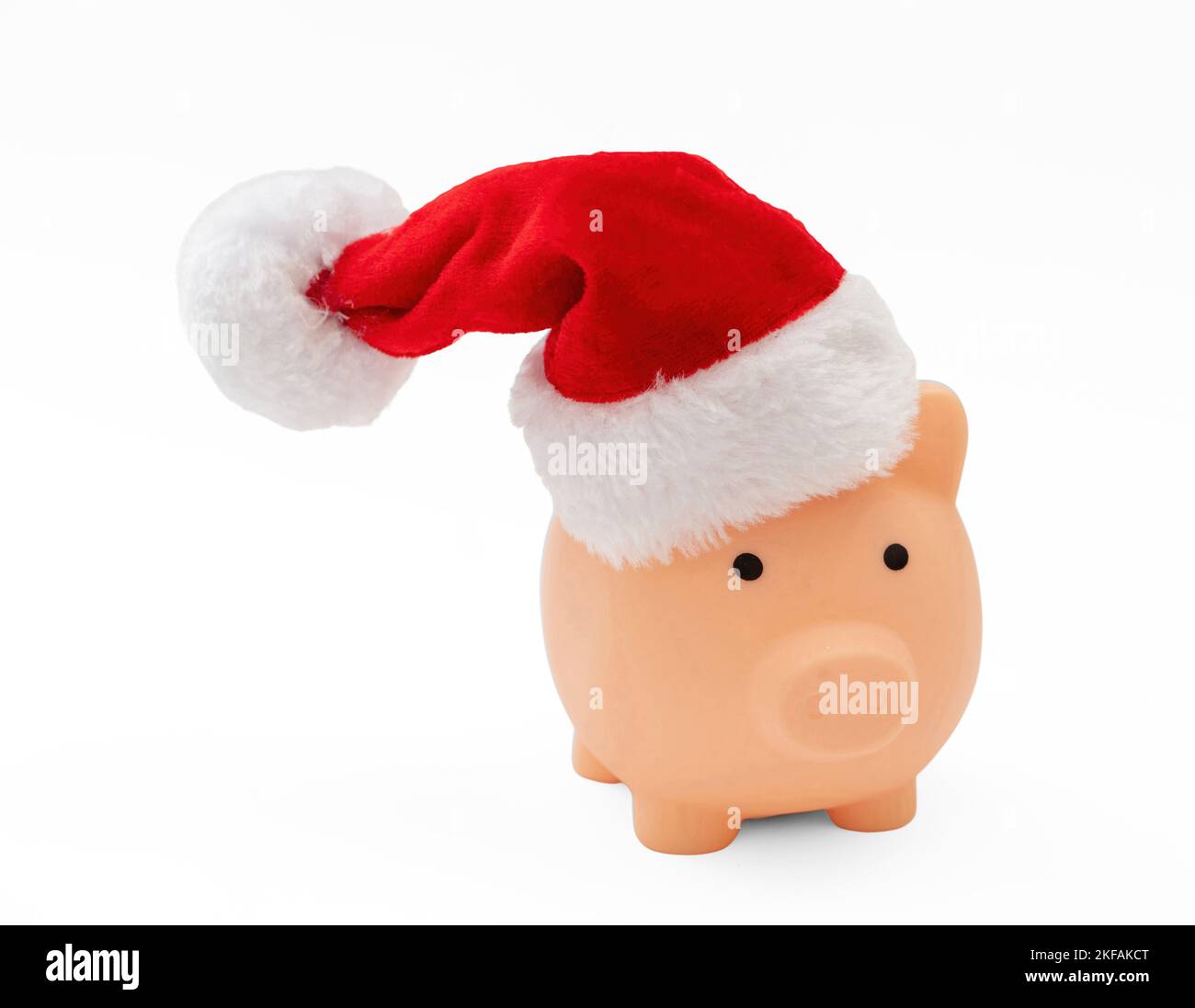 Weihnachtsangebot. Sparschwein mit Santa Hut isoliert auf weißem Hintergrund. Stockfoto