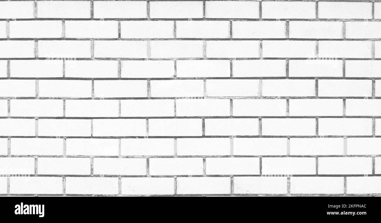 Eine weiß getünchte Ziegelwand, nahtloser Mustertextur Hintergrund Stockfoto