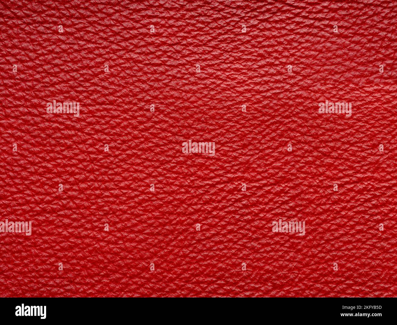 Rotes Qualitätsleder, natürliches Material mit Designlinien-Muster oder rotem abstraktem Hintergrund. Kann Tapete oder Hintergrund Luxus-Event, Design verwenden Stockfoto