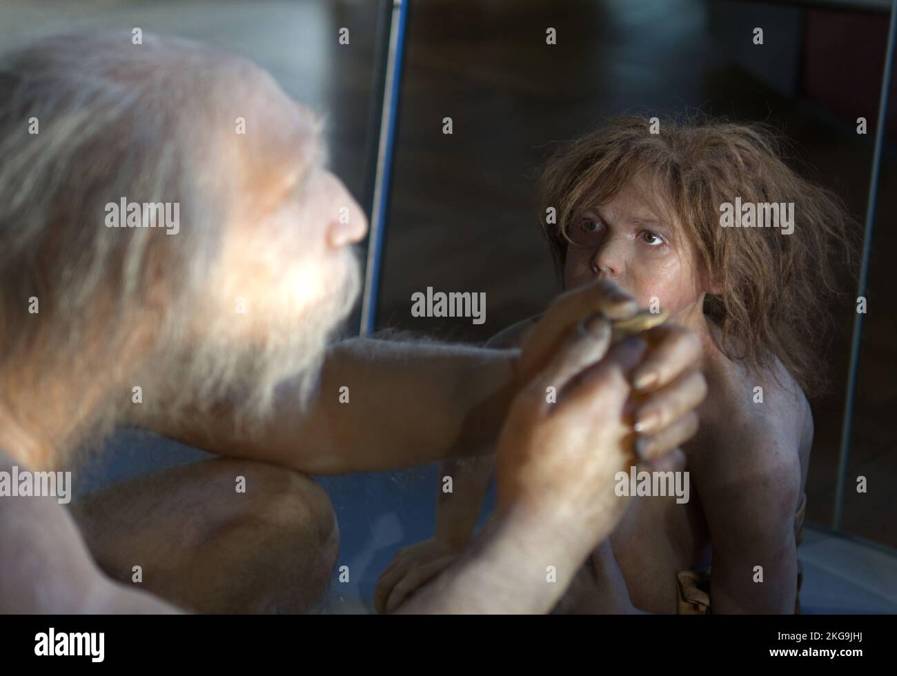 Neandertaler Großvater und Kind Stockfoto