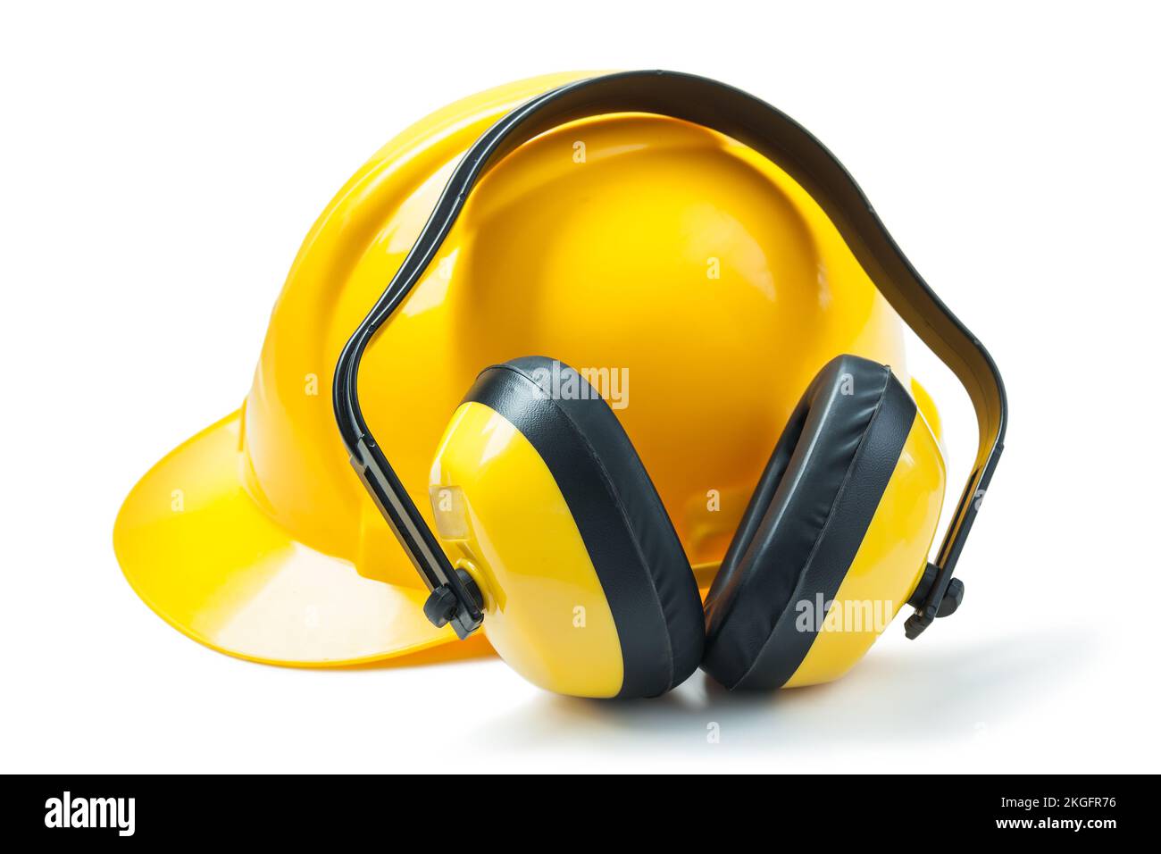 Gelbe Kopfhörer und Helm isoliert Stockfoto