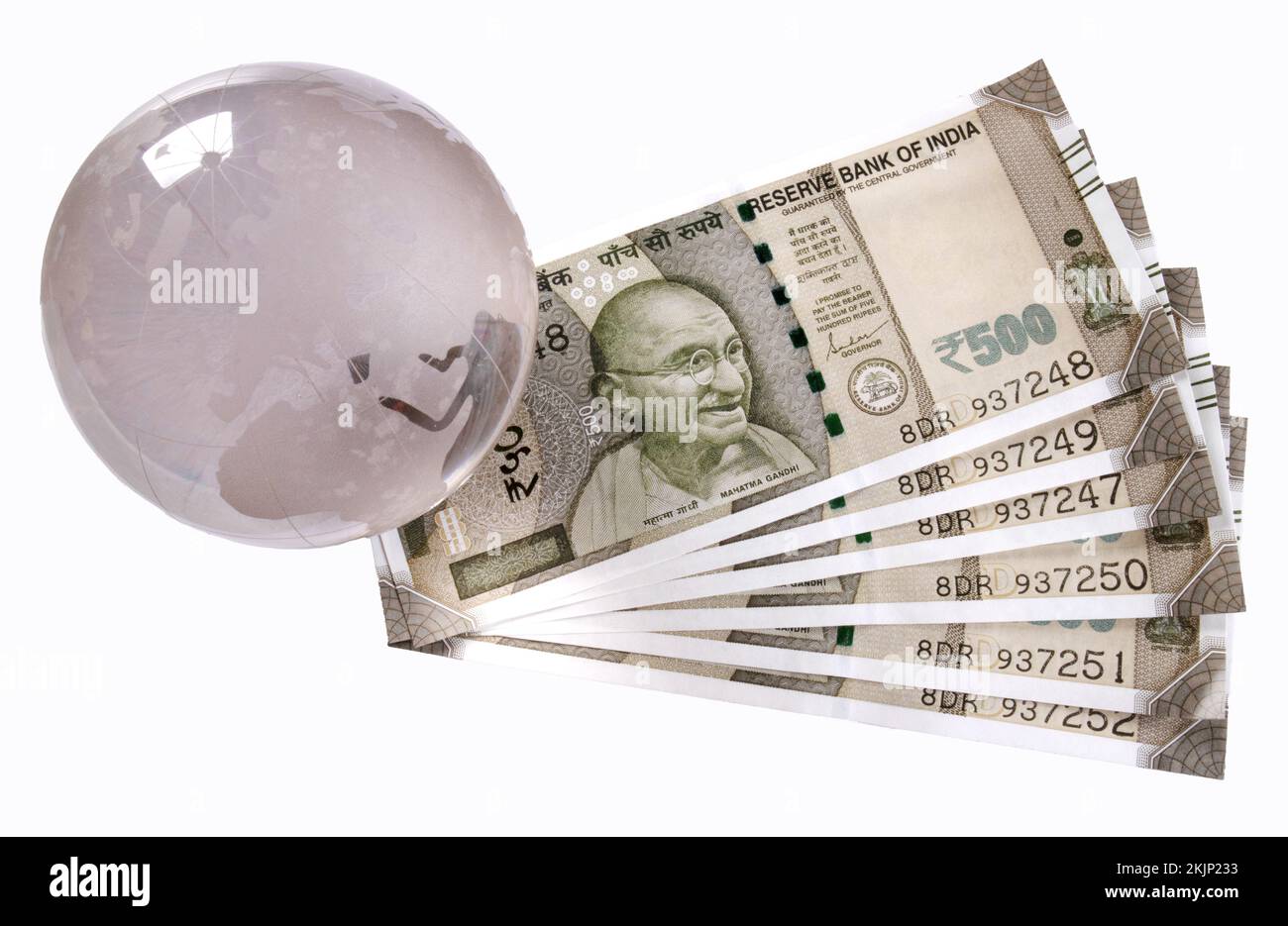 Globus mit indischer Währung Stockfoto