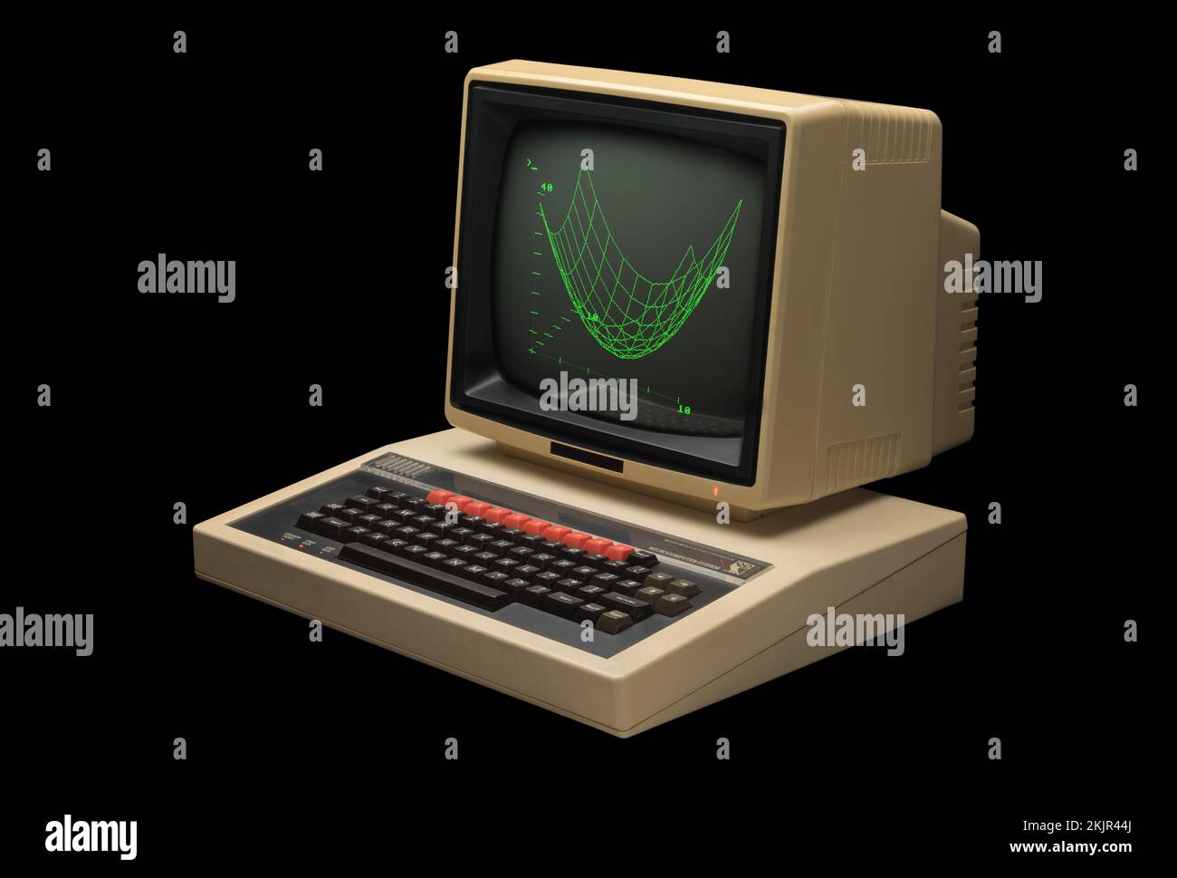 1980er BBC-Mikrocomputer Modell B und grüner Bildschirm mit schräg sichtbarer Grafik auf schwarzem Hintergrund Stockfoto