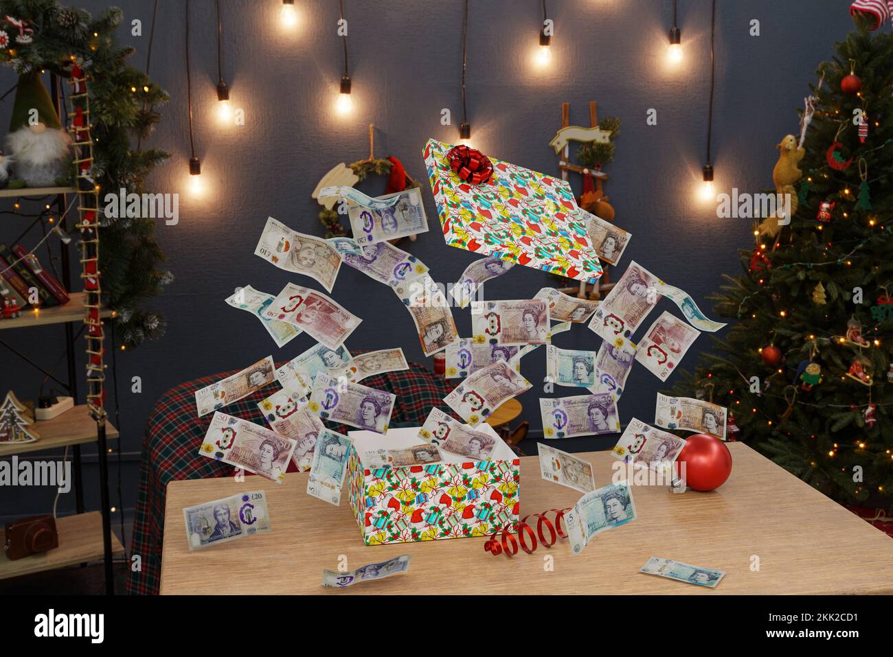 Weihnachten Geschenk von Geld Pfund Bargeld weihnachten präsent UK Geld Geschenkbox Stockfoto