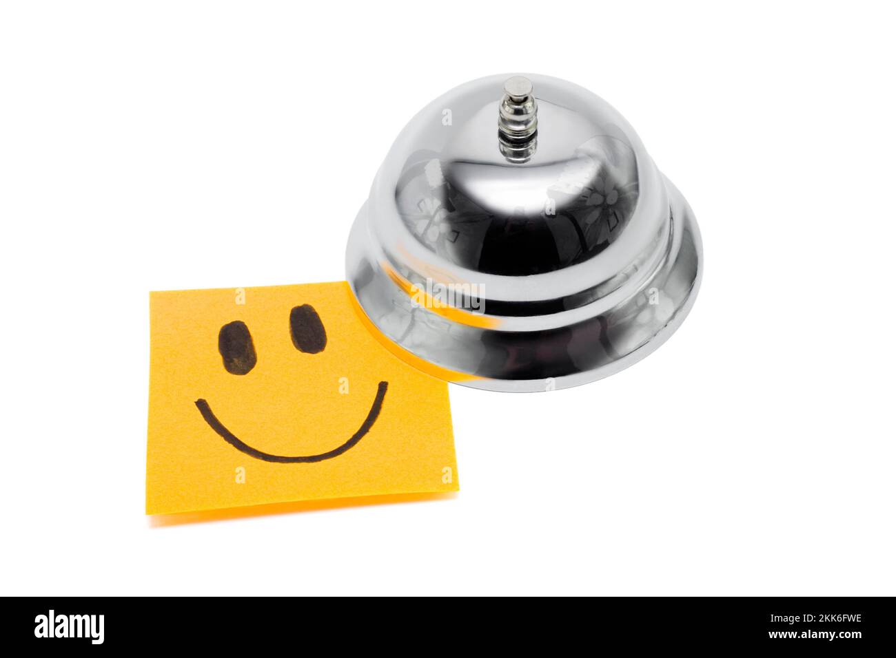 Rezeption Service Bell mit Smiley Hinweis, In eine Darstellung der Service mit einem Lächeln auf weißem Hintergrund Stockfoto