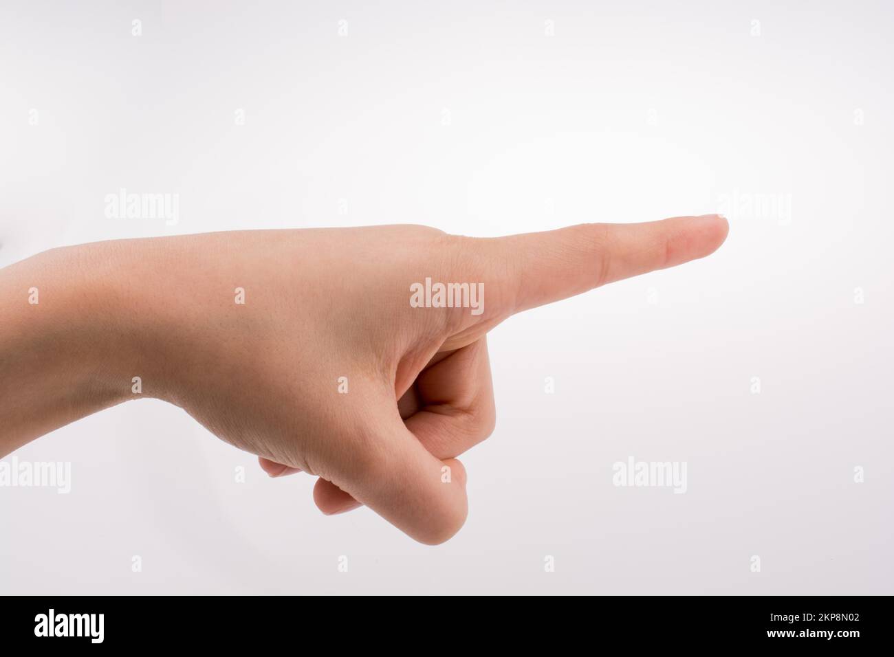 Menschliche Hand zeigt auf weißem Hintergrund Stockfoto