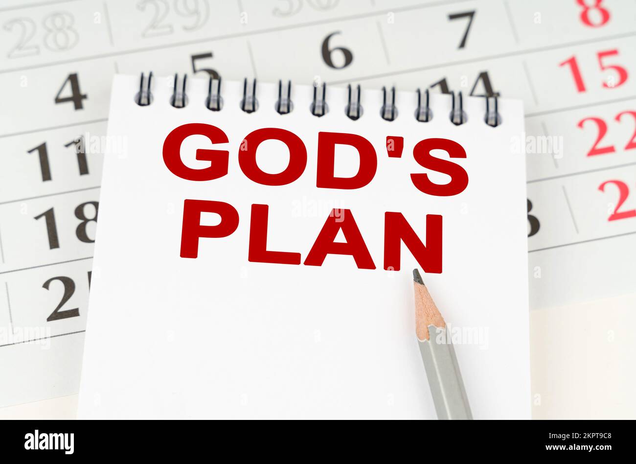 Geschäftsplanungskonzept. Auf dem Kalender steht ein Notizbuch mit der Inschrift - Gottes Plan Stockfoto