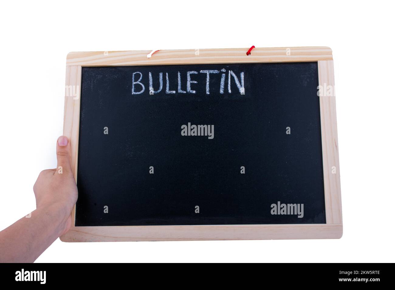 Die Hand hält das Brett mit dem Titel des Bulletins Stockfoto