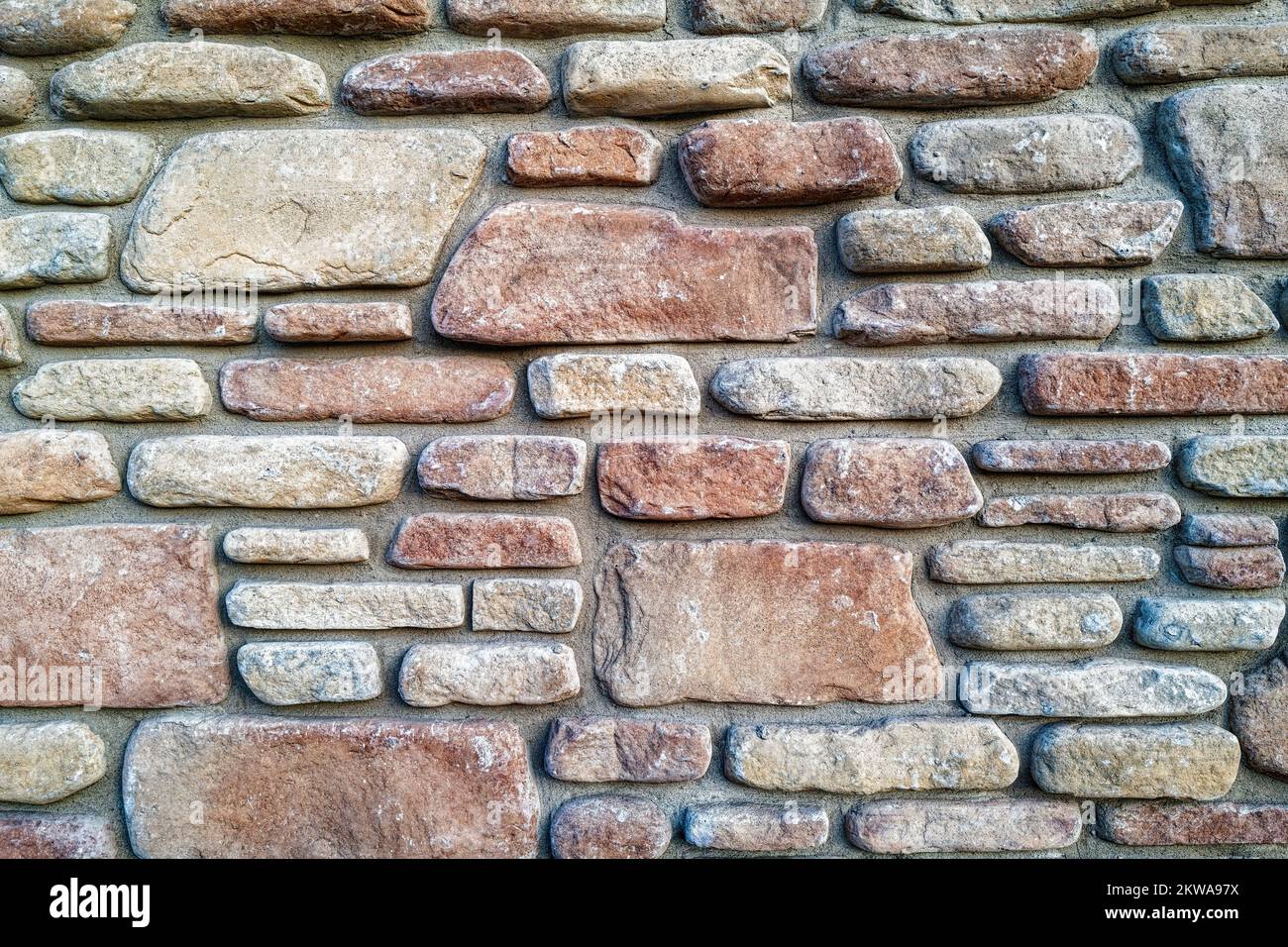 Details von Steinen an einer Steinmauer Stockfoto