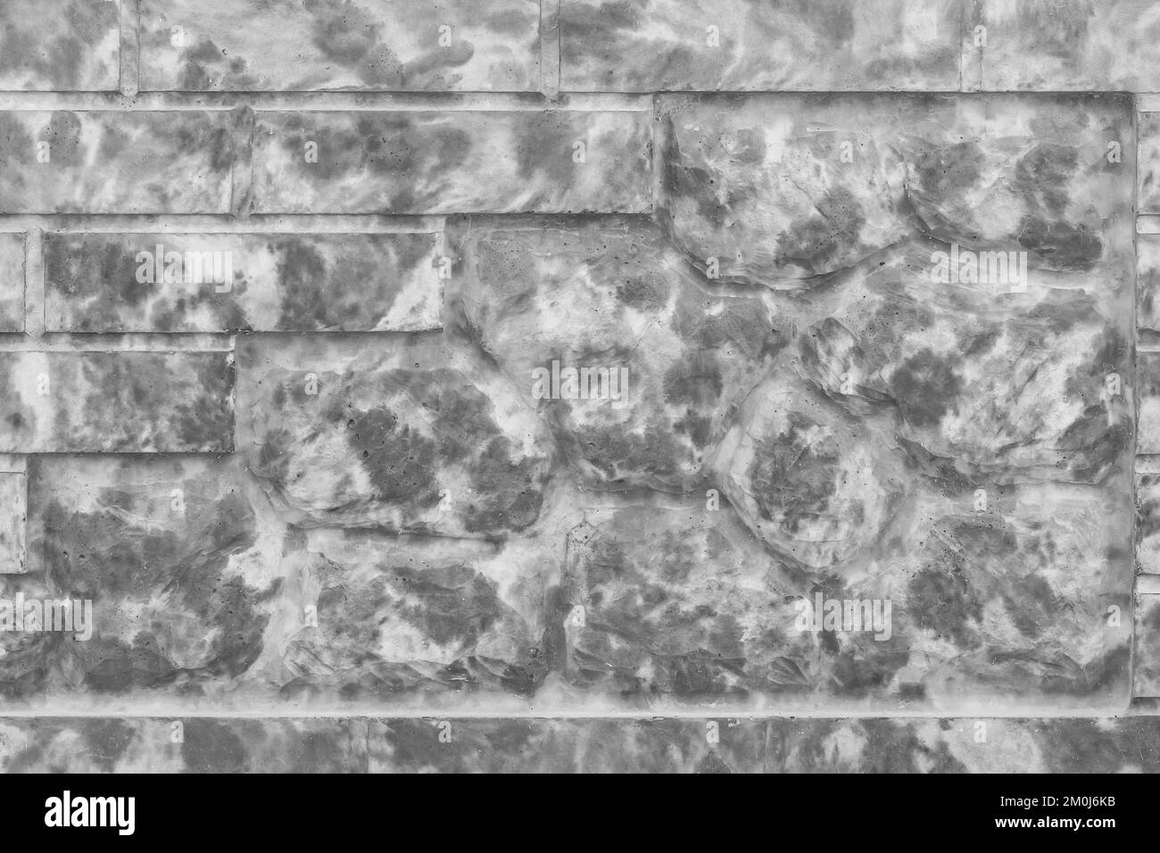 Dekorativer Ziegelsteinzaun abstraktes dunkelgraues Punktmuster moderner Hintergrund für Innenwände. Stockfoto
