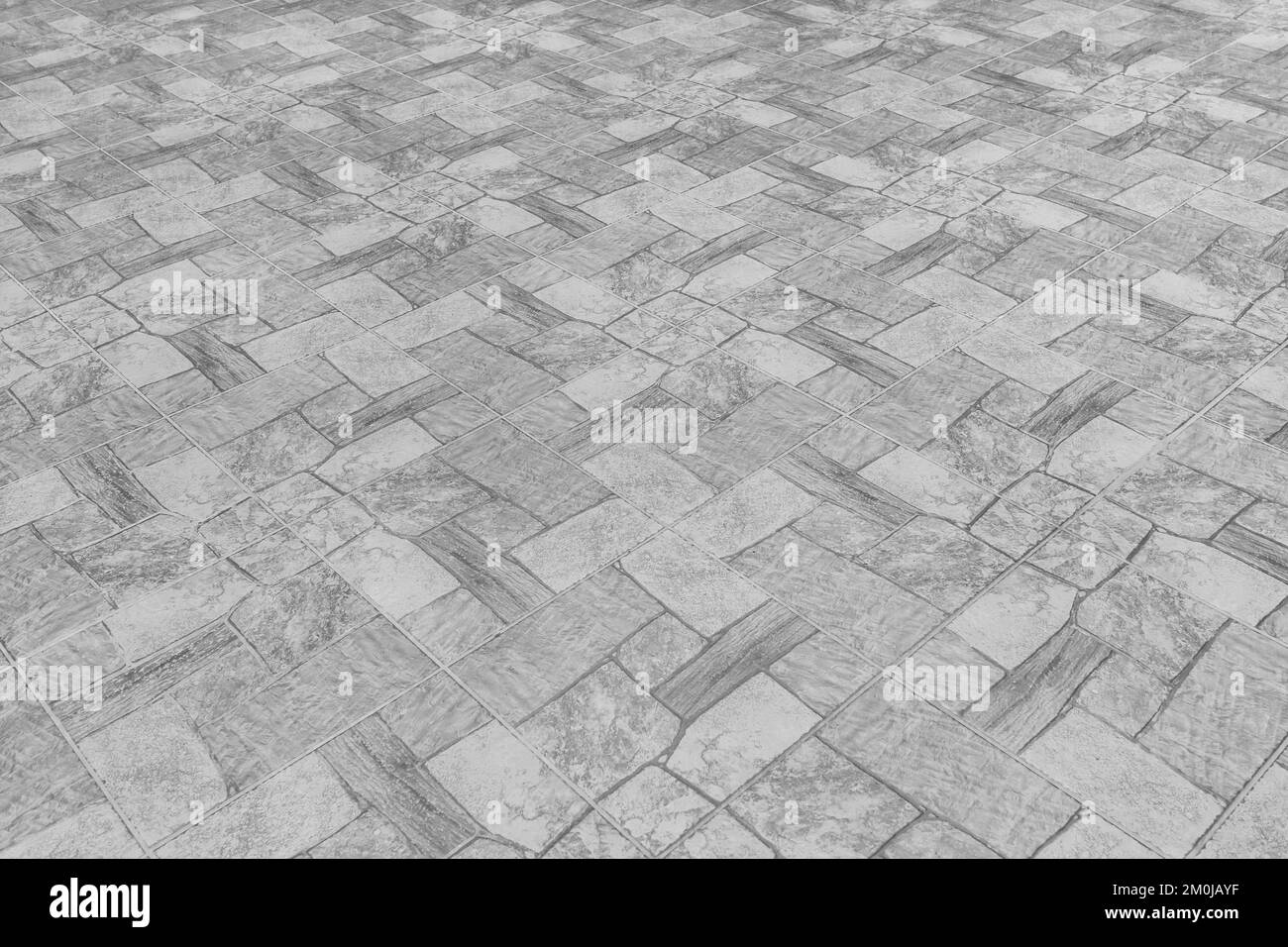 Grauer Fliesenboden mit abstraktem Muster aus Mosaikhintergrund mit Steinoberfläche. Stockfoto