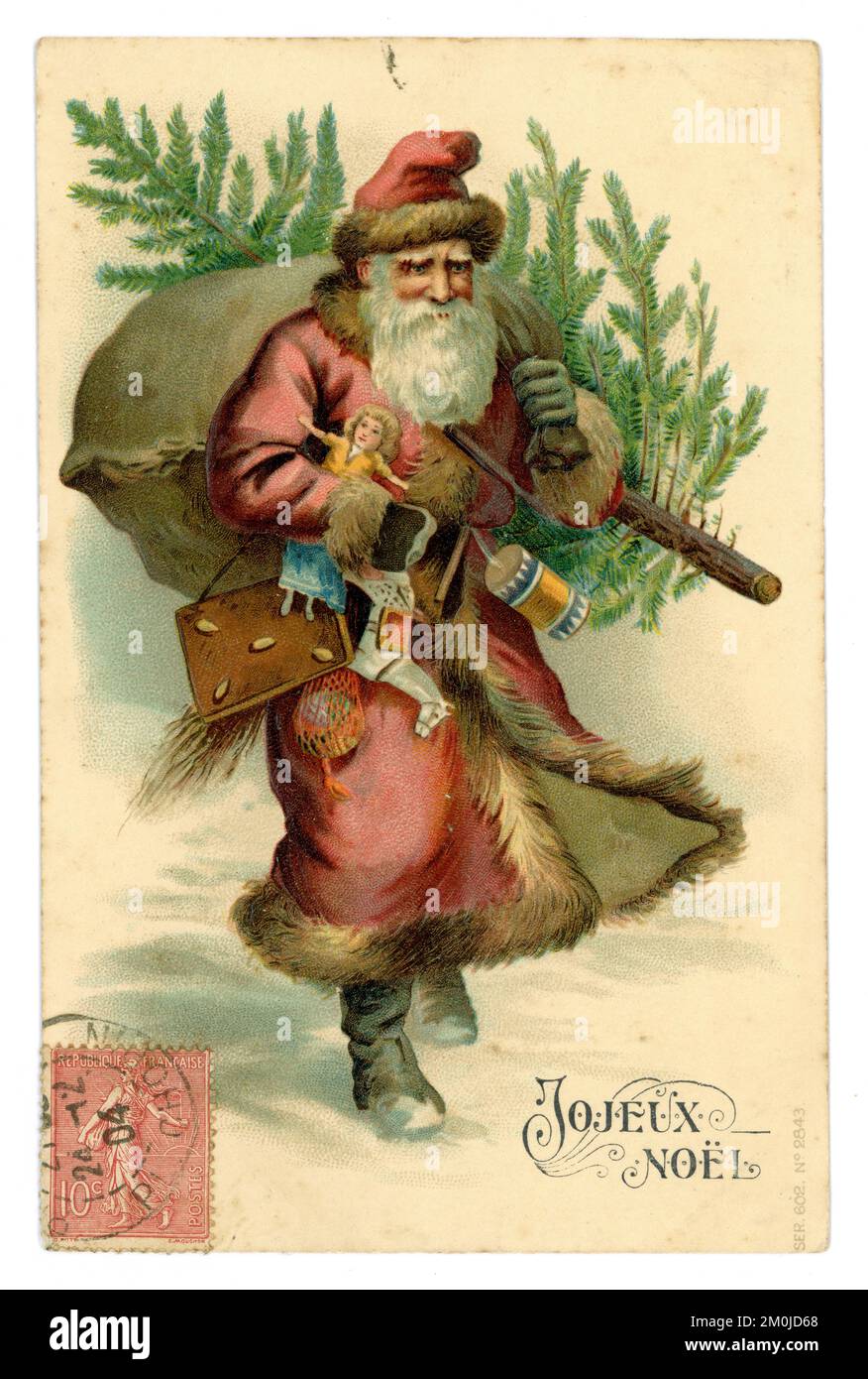 Edwardianische Ära Grußkarte Postkarte des Weihnachtsvaters mit Geschenken und einem Baum mit französischem Stempel auf der Vorderseite, Grußworte ist Joyeux Noel. Veröffentlicht am 24. Dezember 1904 Stockfoto