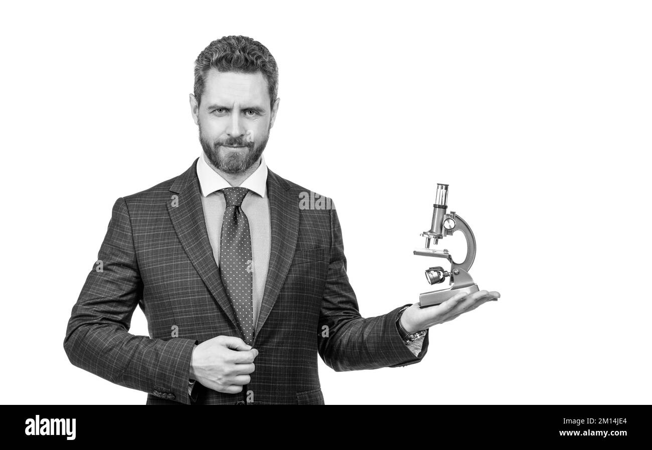 Zukunft. Einzigartige Medizin Erfindung. Geschäftsmann präsentiert Mikroskop. Erfolgreicher Mann Wissenschaftler Stockfoto
