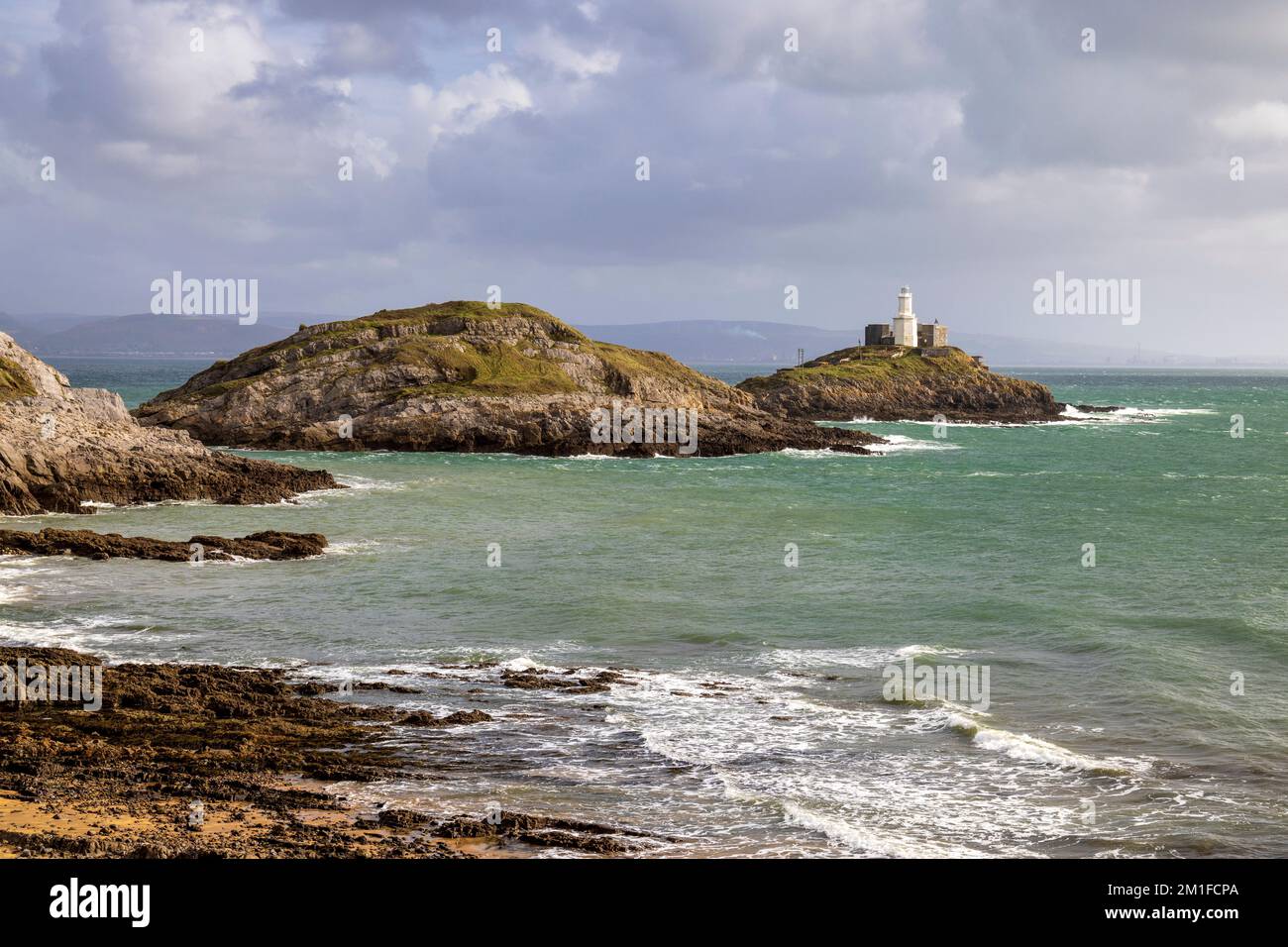 Bracelet Bay und Mumbles Lighthouse, Gower Peninsula, South Wales Stockfoto