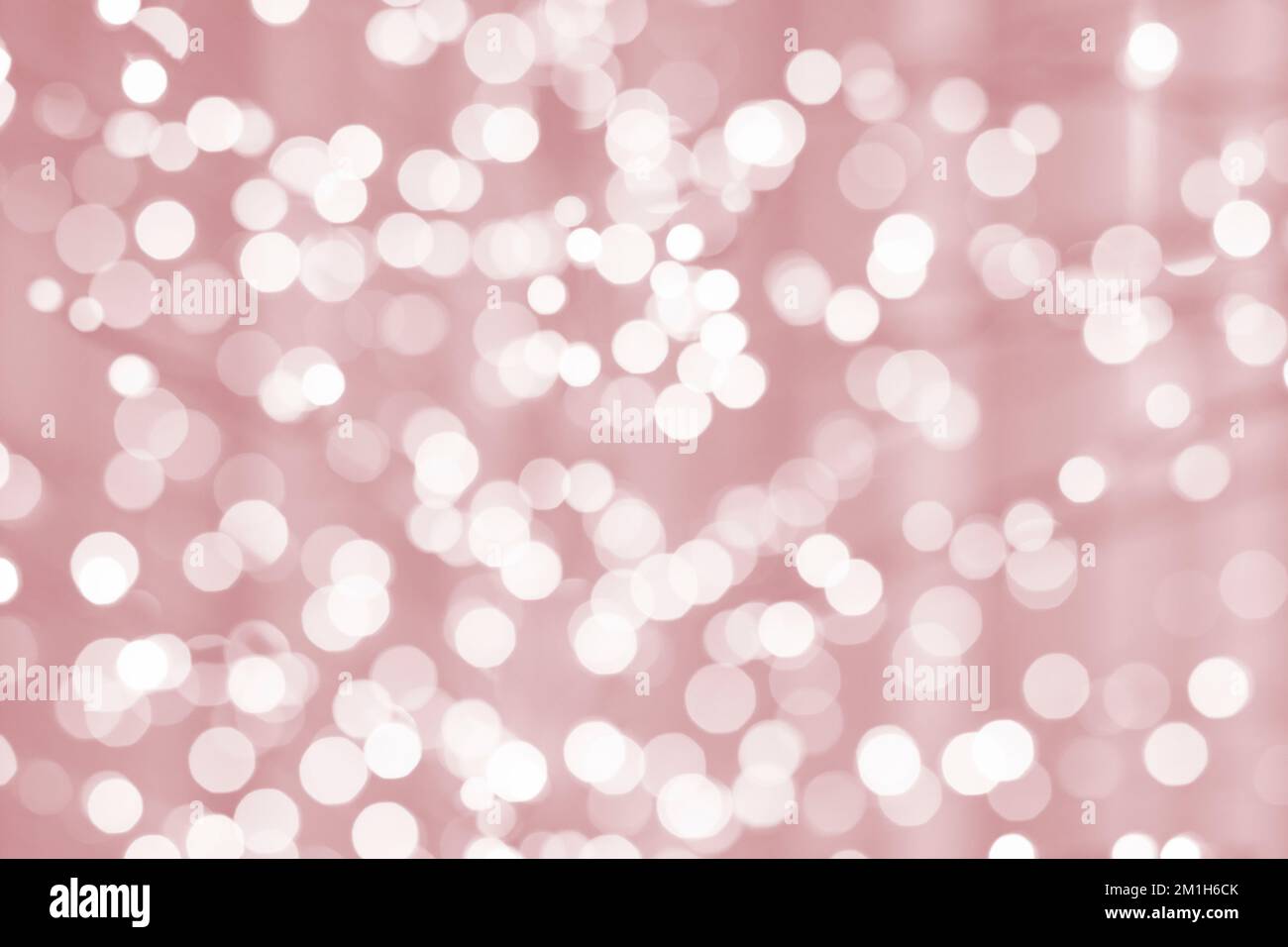 Unscharfe weihnachtslichter, pinkfarbener Hintergrund Stockfoto