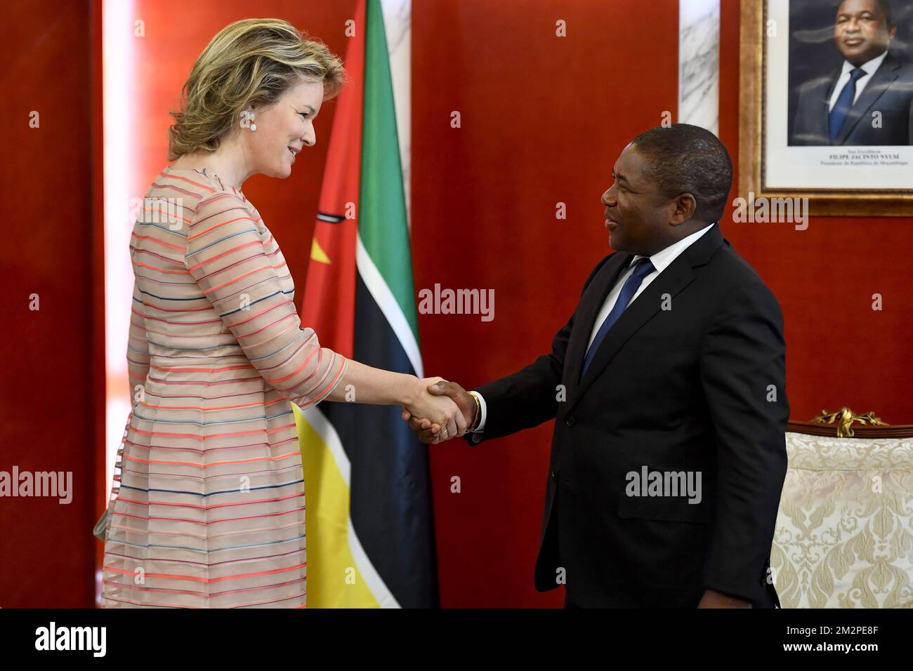 Queen Mathilde of Belgium and Mozanbique President Filipe Nyusi shake ...
