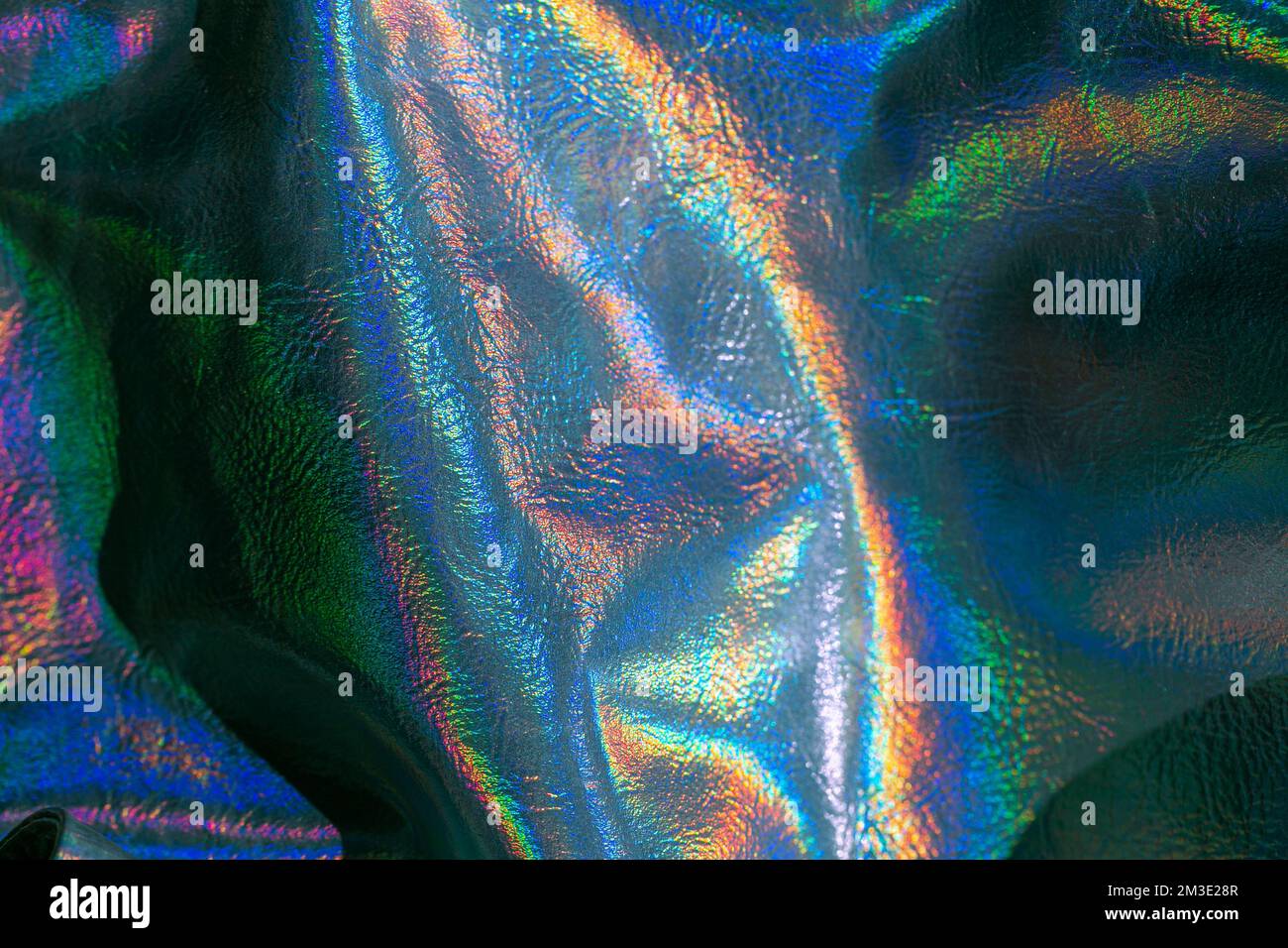 Holographischer Hintergrund. Holografische Tapete aus Metall. Abstraktes holografisches background.beautiful-Metallic-glänzendes Gewebe Stockfoto