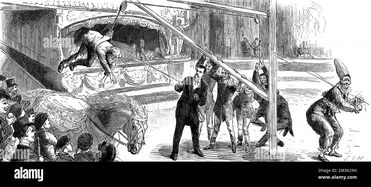 Reitstunde im Ring von Sanger's Circus. Ein Möchtegern-Fahrer wird mit einer rotierenden Winde auf ein laufendes Pferd gehoben. Datum: 1884 Stockfoto