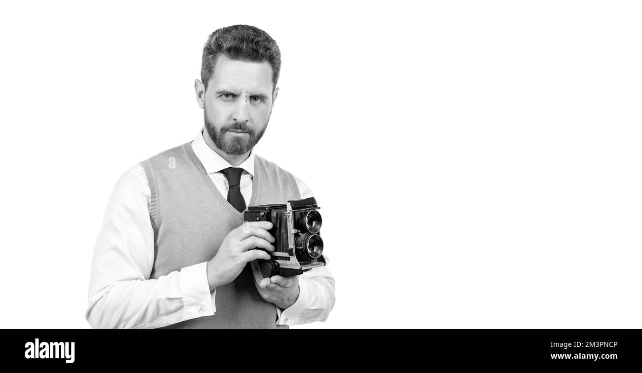 Männlicher Fotograf fotografiert. Lächelnder Mann fotografiert. Stockfoto