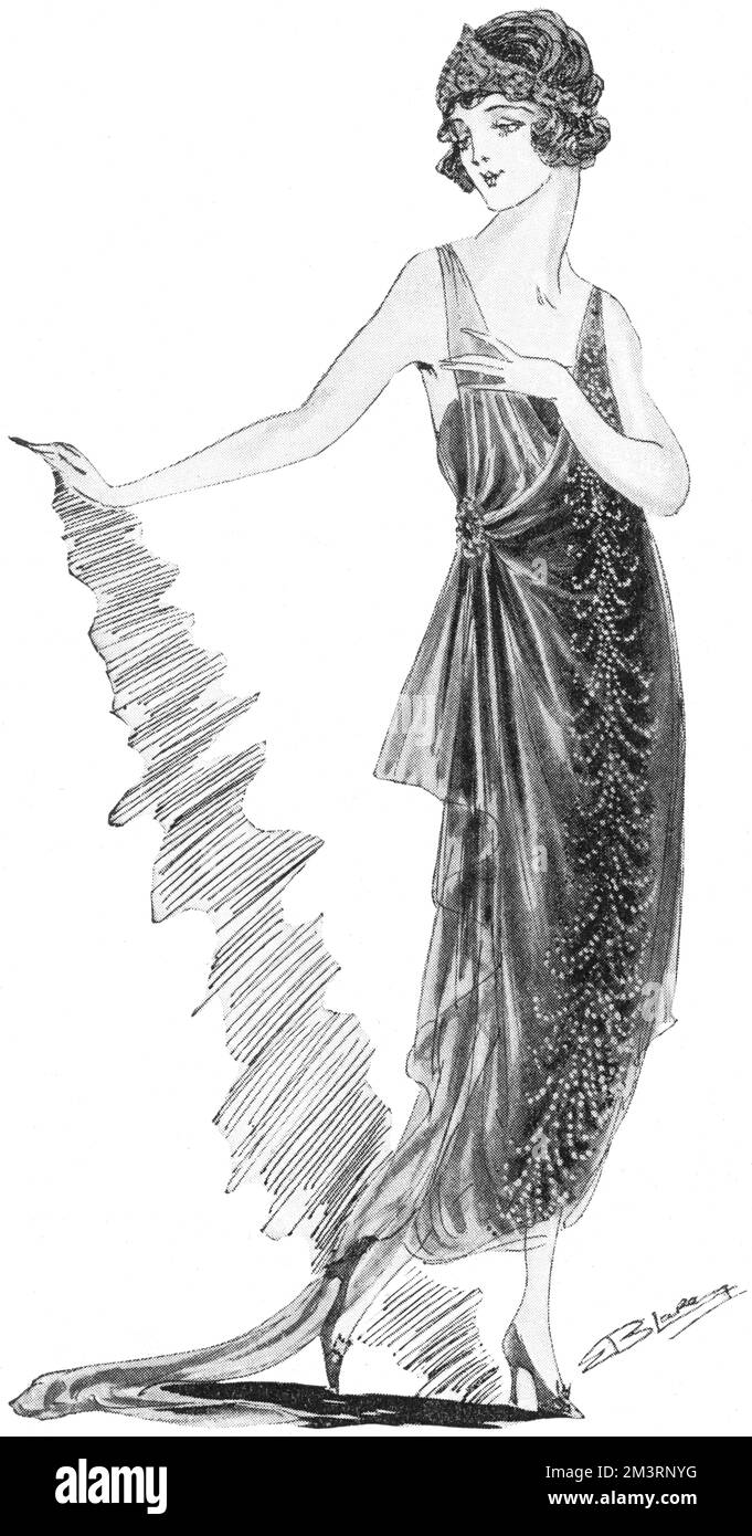 Abendkleid aus schwarzem Netz, geschmückt mit einer langen Straußenfeder, geschmiedet mit Diamante, von Elspeth Phelps. Datum: 1920 Stockfoto