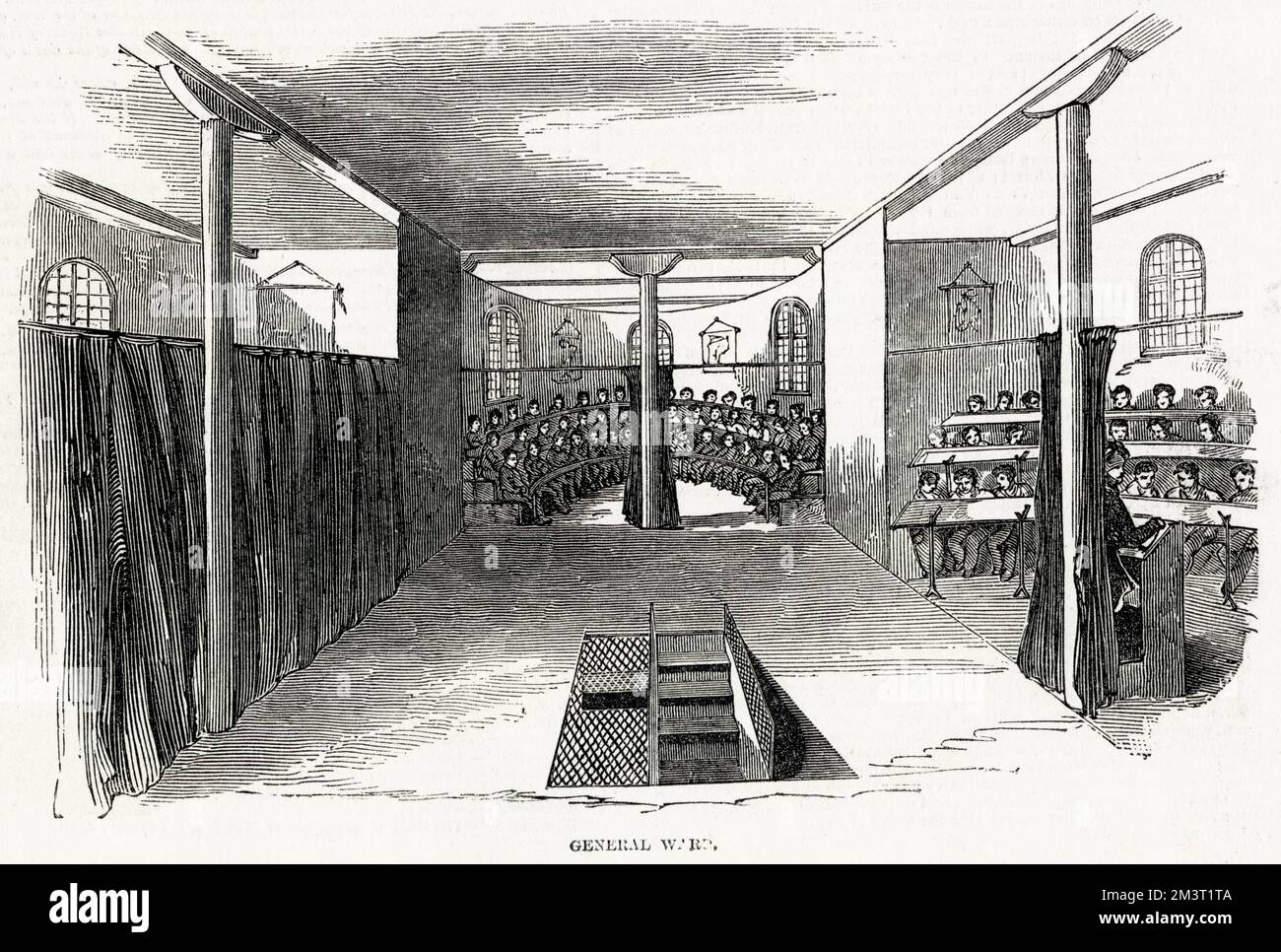 Klassenzimmer im Parkhurst Juvenile Prison mit Jungen, die in Gruppen unterrichtet werden, die in Reihen auf halbrunden Bänken sitzen. Stockfoto