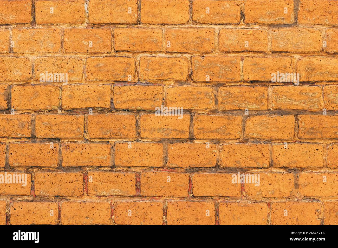 Textur abgenutzter rustikaler Ziegelwandflächen als Hintergrund Stockfoto