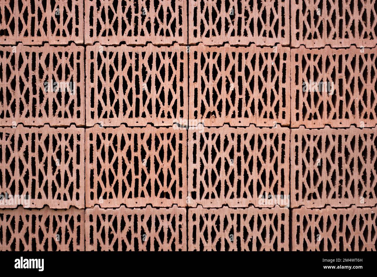 Holey Red Brick Texturte Nahaufnahme Stockfoto