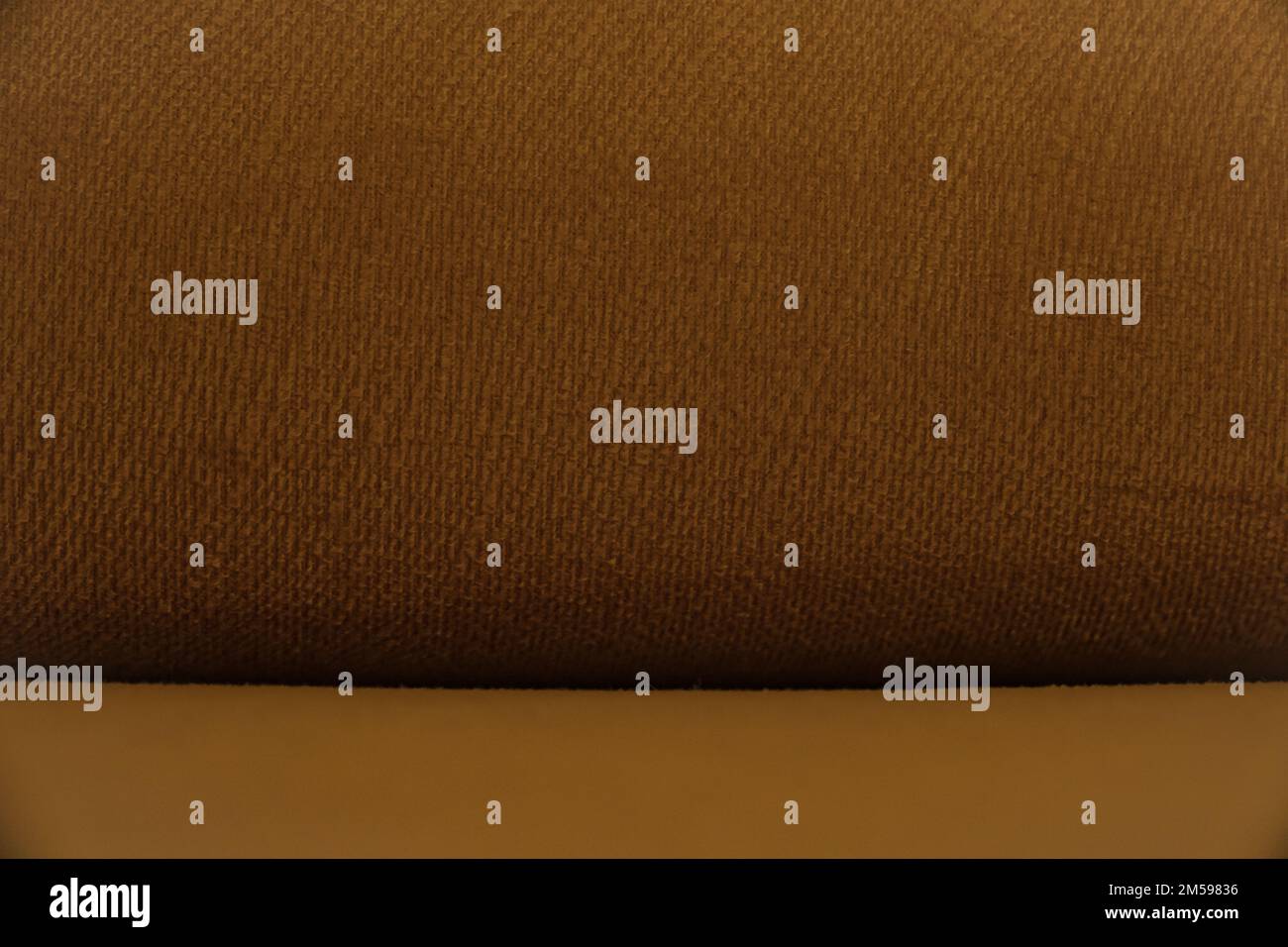 Orangefarbenes Polstermuster, strukturierter Hintergrund. Stockfoto