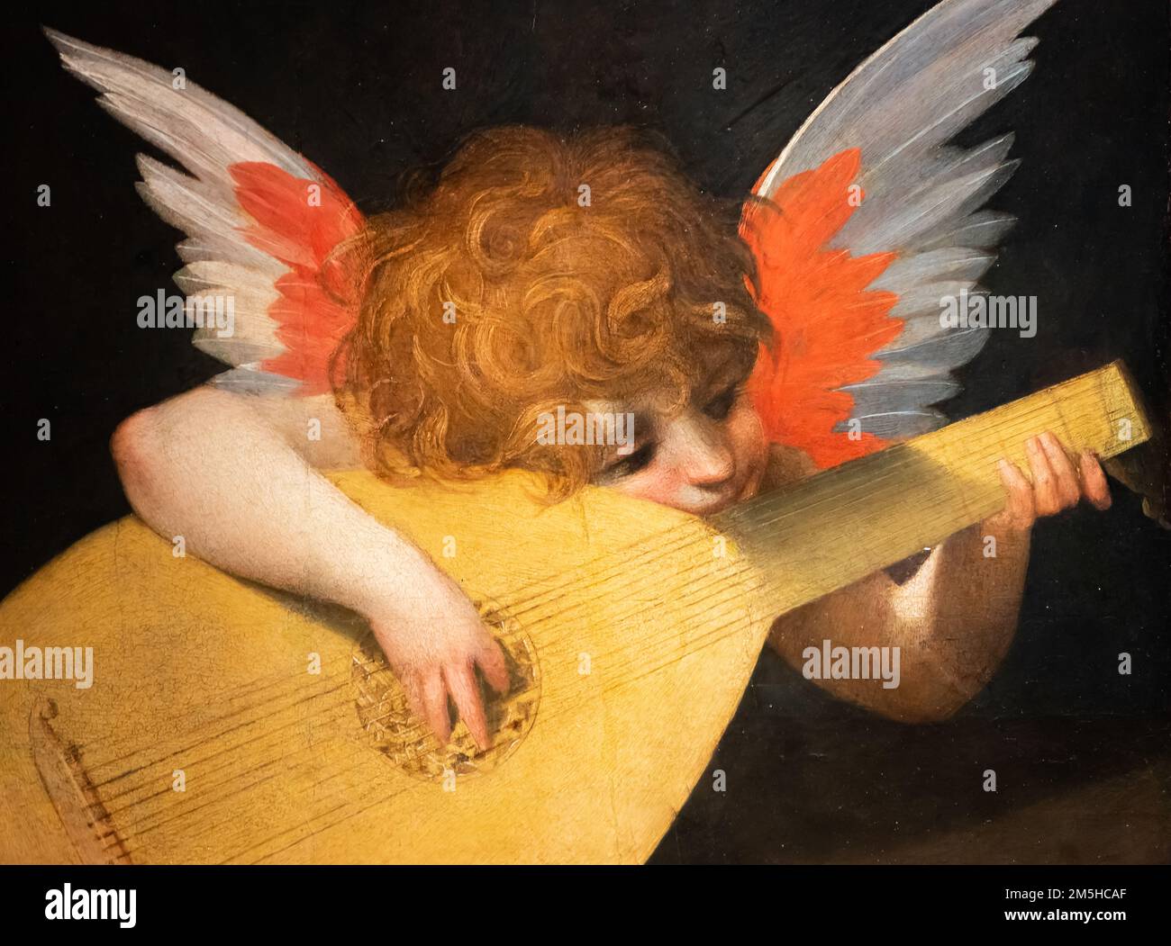 Nahaufnahme eines mittelalterlichen Gemäldes von Amor, der Laute spielt Stockfoto