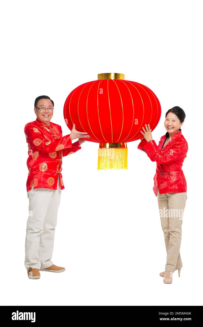 Frohe chinesische Neujahrskostümfamilie Stockfoto