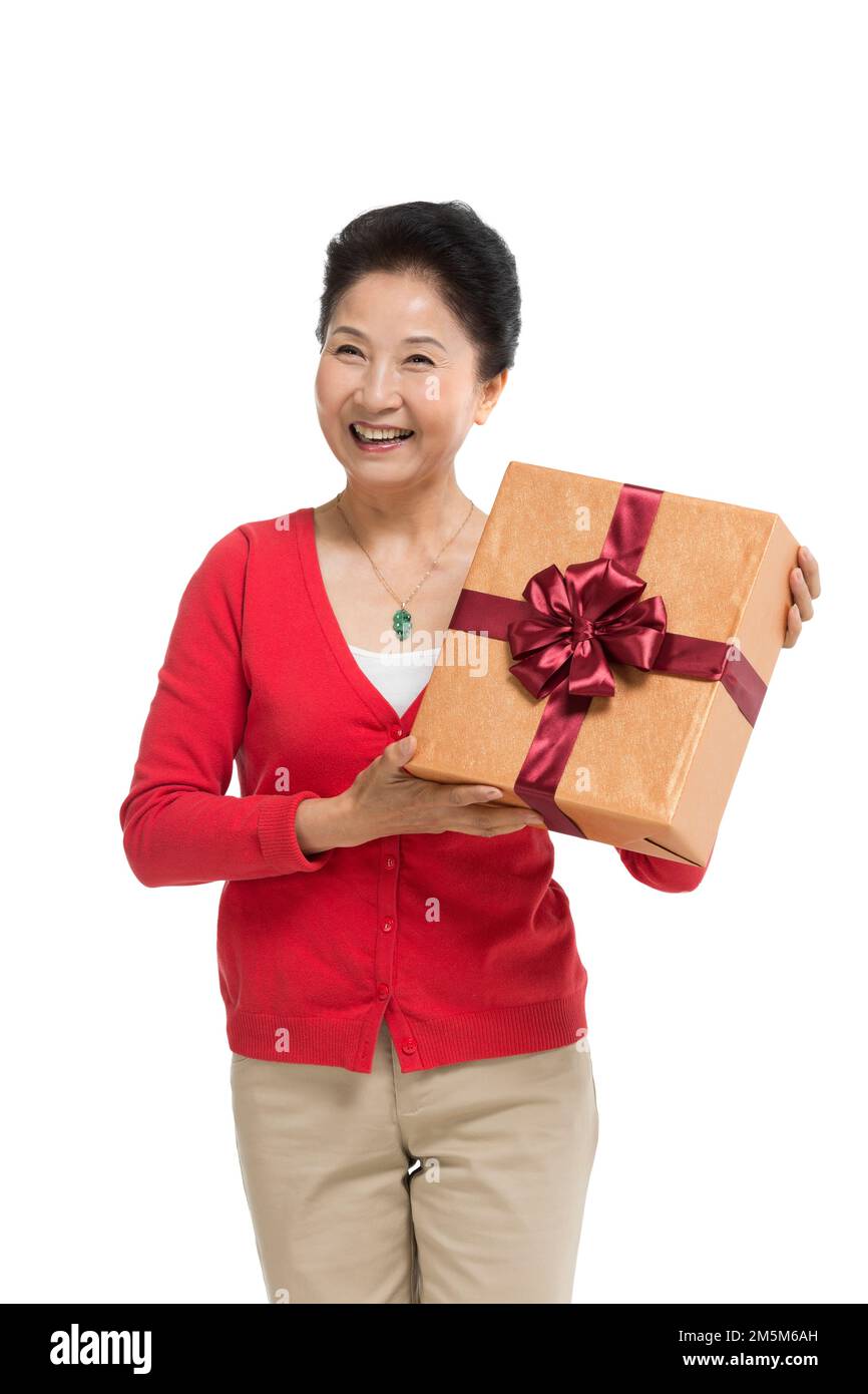 Zelt bis zu Frauen mittleren Alters und alten Frauen, die die Geschenkbox halten Stockfoto