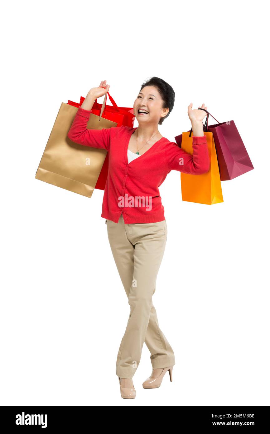 Zelt bis zu Frauen mittleren Alters und alten Frauen, die Einkaufstaschen tragen Stockfoto