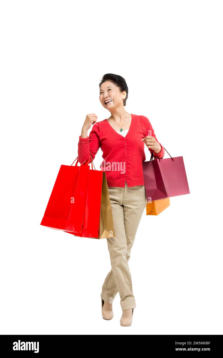 Zelt bis zu Frauen mittleren Alters und alten Frauen, die Einkaufstaschen tragen Stockfoto