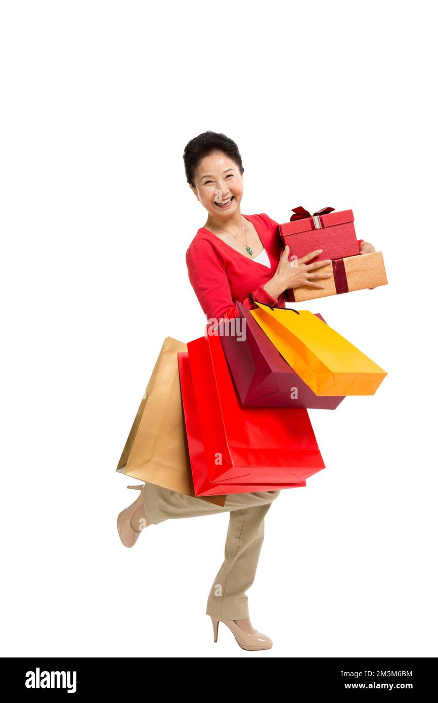 Zelt bis zu Frauen mittleren Alters und alten Frauen, die Einkaufstaschen tragen Stockfoto