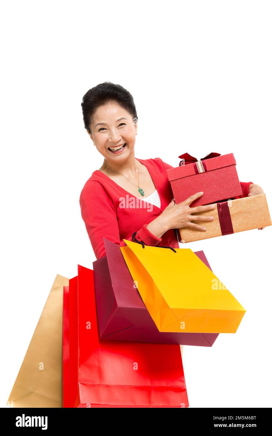 Zelt bis zu Frauen mittleren Alters und alten Frauen, die Einkaufstaschen tragen Stockfoto