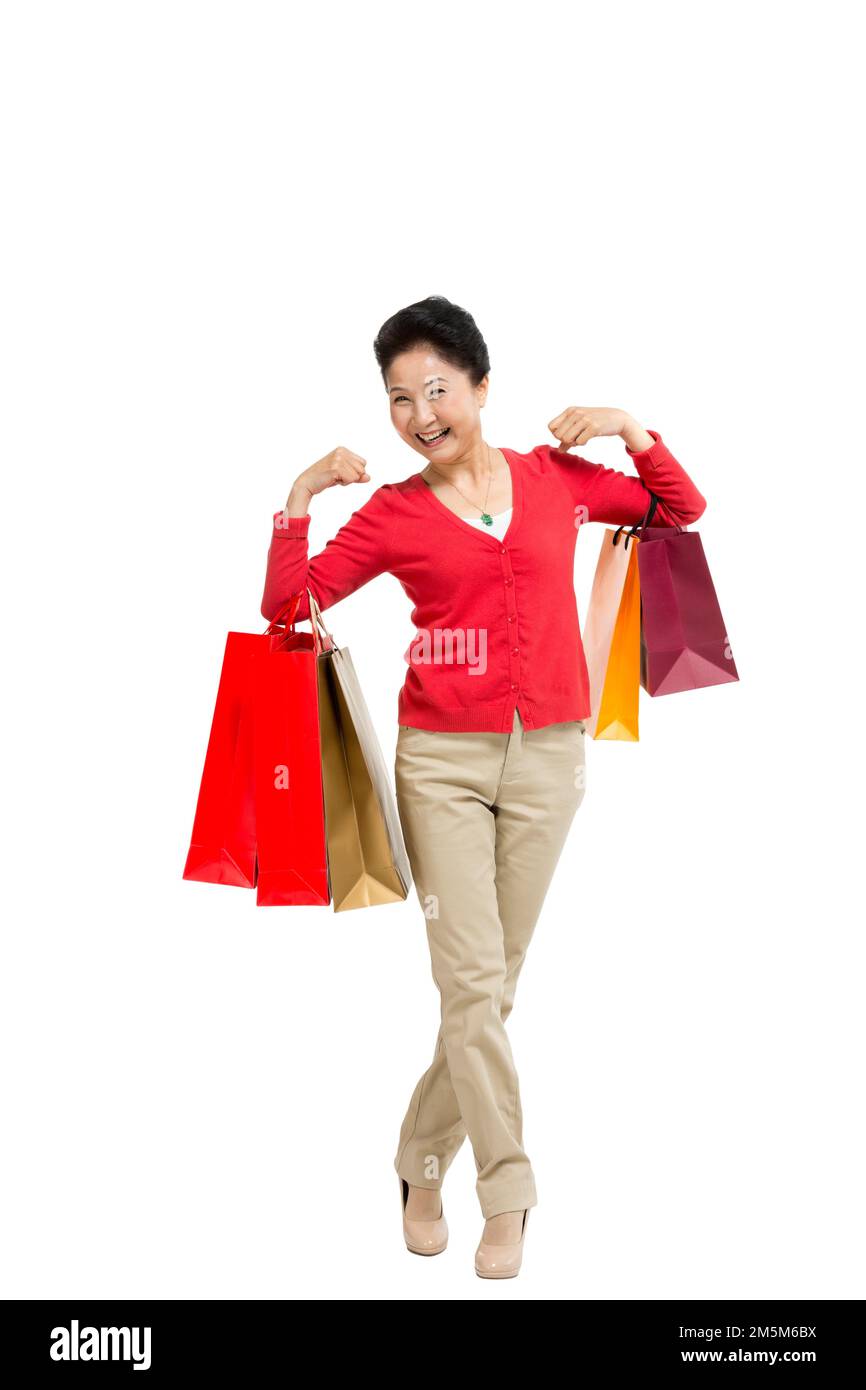 Zelt bis zu Frauen mittleren Alters und alten Frauen, die Einkaufstaschen tragen Stockfoto