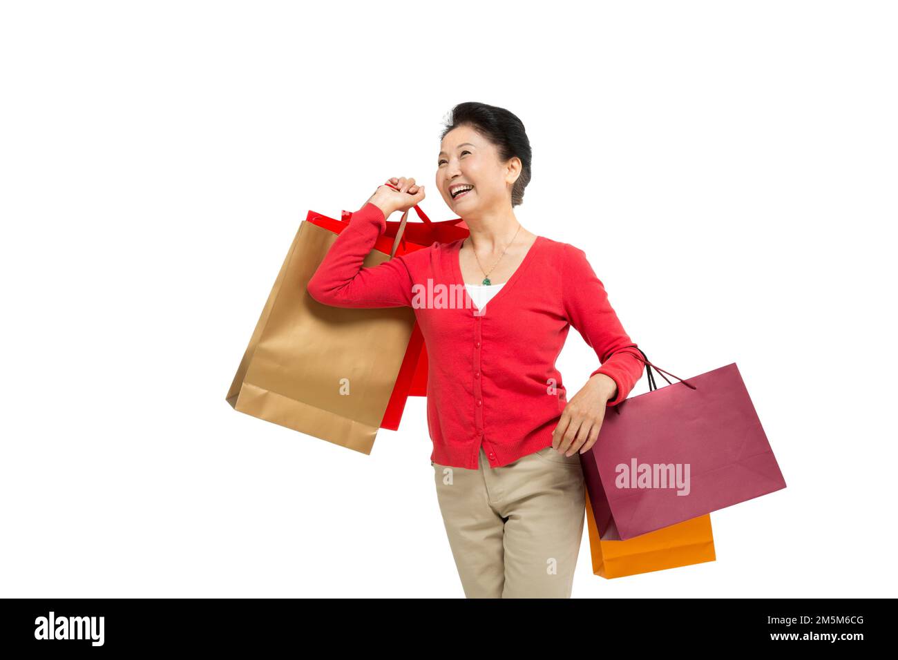 Zelt bis zu Frauen mittleren Alters und alten Frauen, die Einkaufstaschen tragen Stockfoto