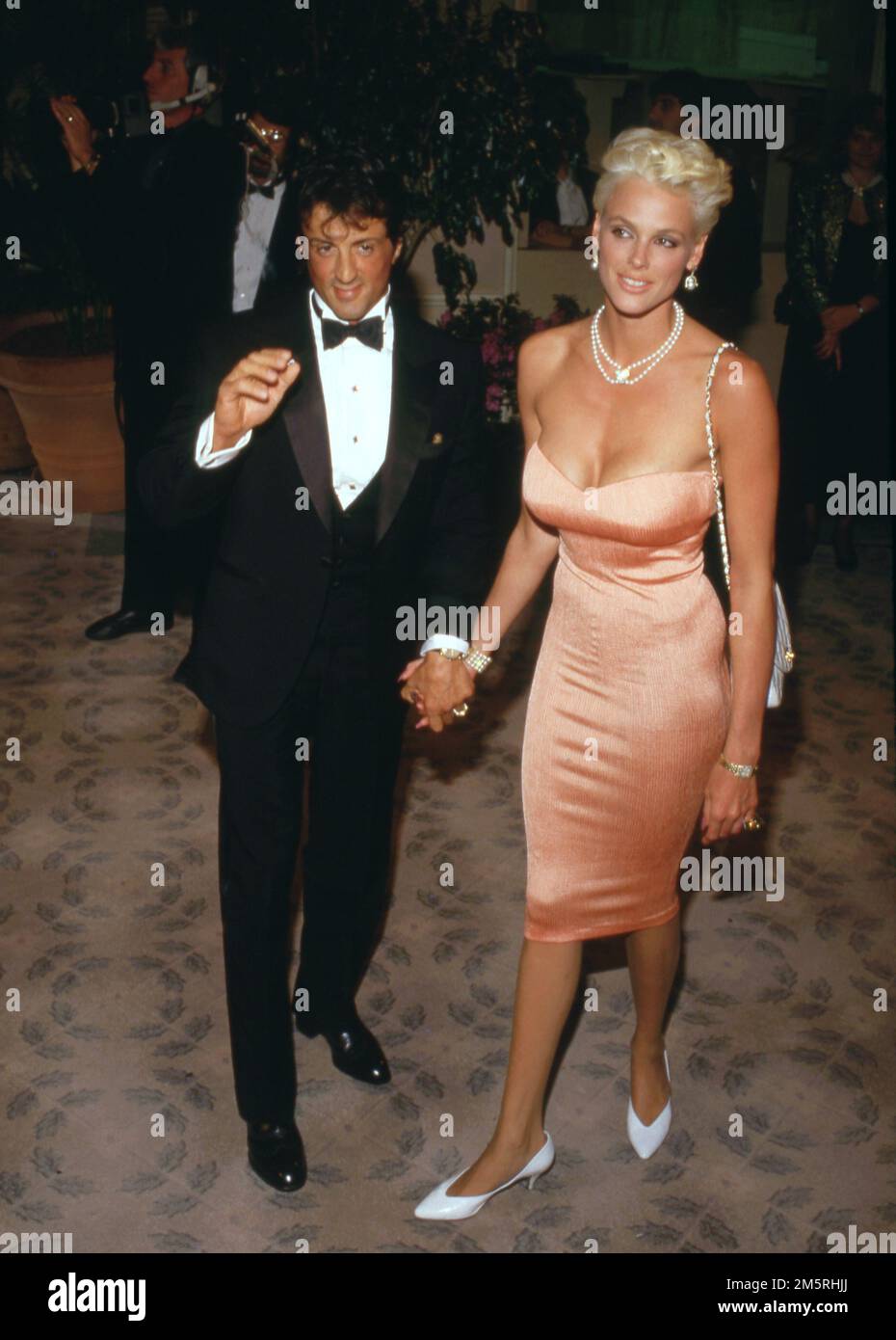 Sylvester Stallone und Brigitte Nielsen beim AFI Life Achievement Award zu Ehren von Barbara Stanwyck im Beverly Hilton Hotel in Beverly Hills, Kalifornien, 09. April 1987 Gutschrift: Ralph Dominguez/MediaPunch Stockfoto