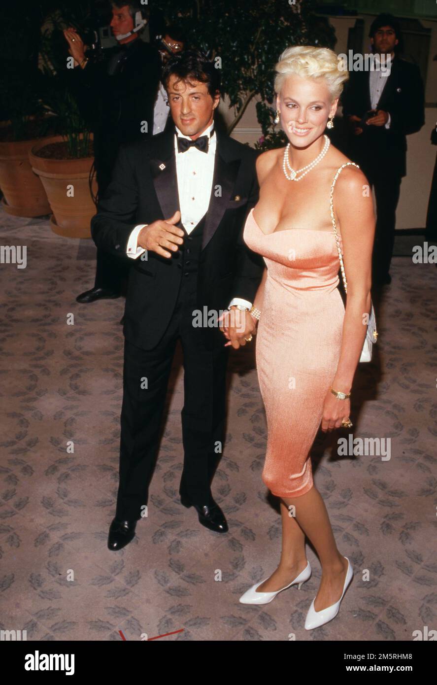 Sylvester Stallone und Brigitte Nielsen beim AFI Life Achievement Award zu Ehren von Barbara Stanwyck im Beverly Hilton Hotel in Beverly Hills, Kalifornien, 09. April 1987 Gutschrift: Ralph Dominguez/MediaPunch Stockfoto