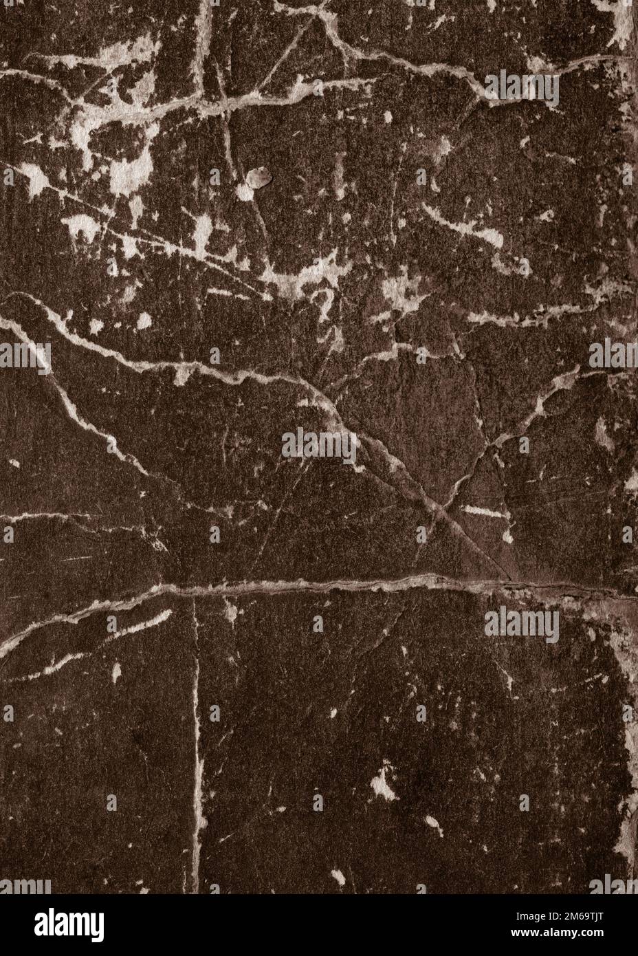 Altes, kollabierendes Papier mit Rissen und Kratzern Stockfoto