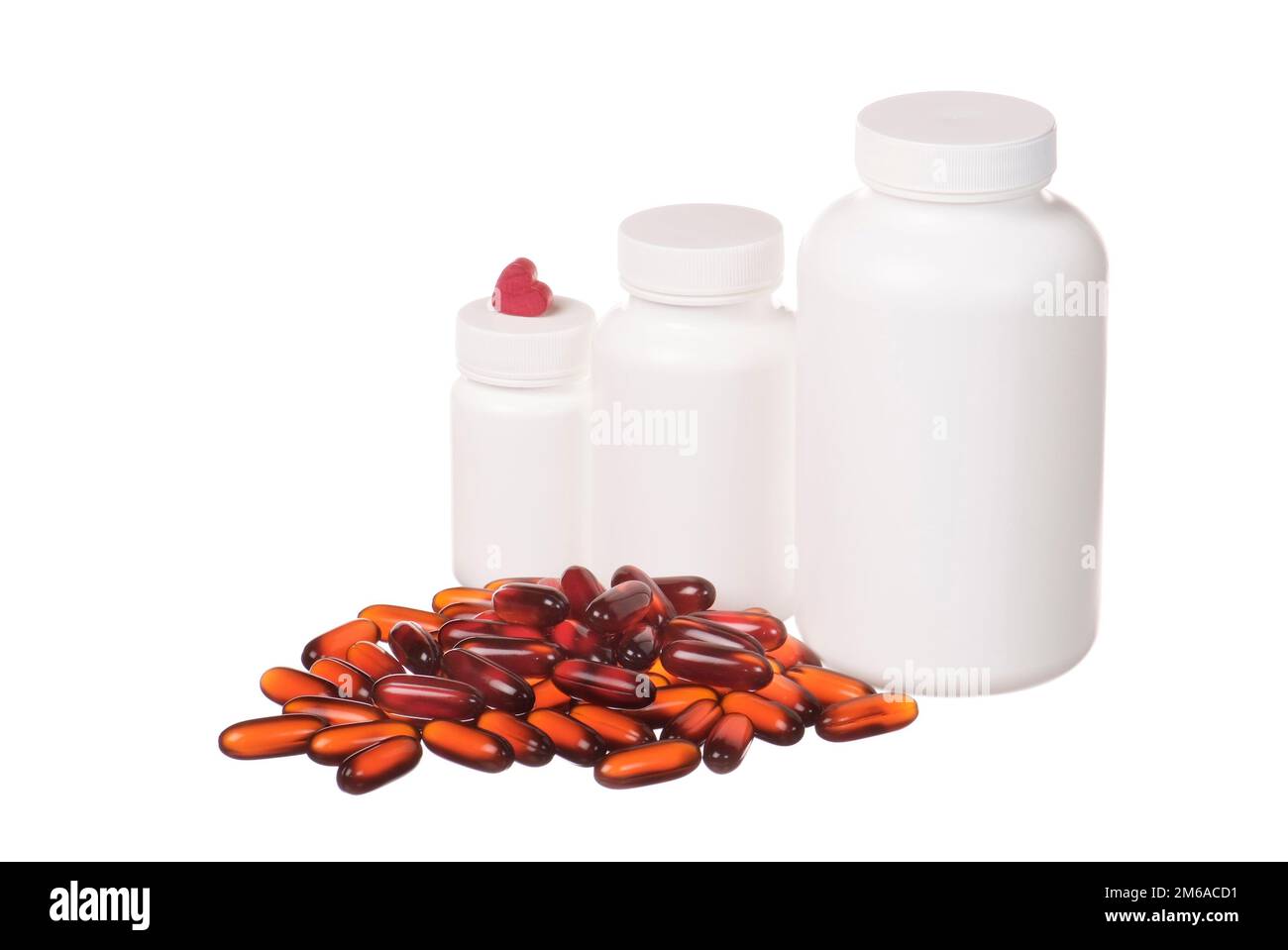 Bunte Pillen und weiße Behälter isoliert auf weiß Stockfoto