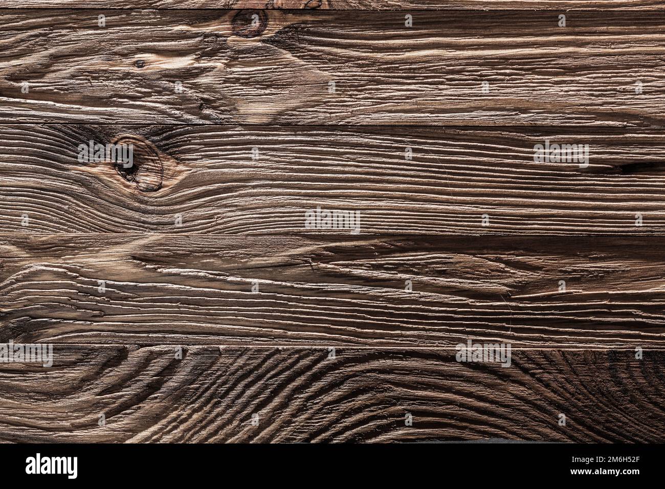Nahaufnahme einer braunen alten Holzstruktur mit horizontalen Brettern Stockfoto