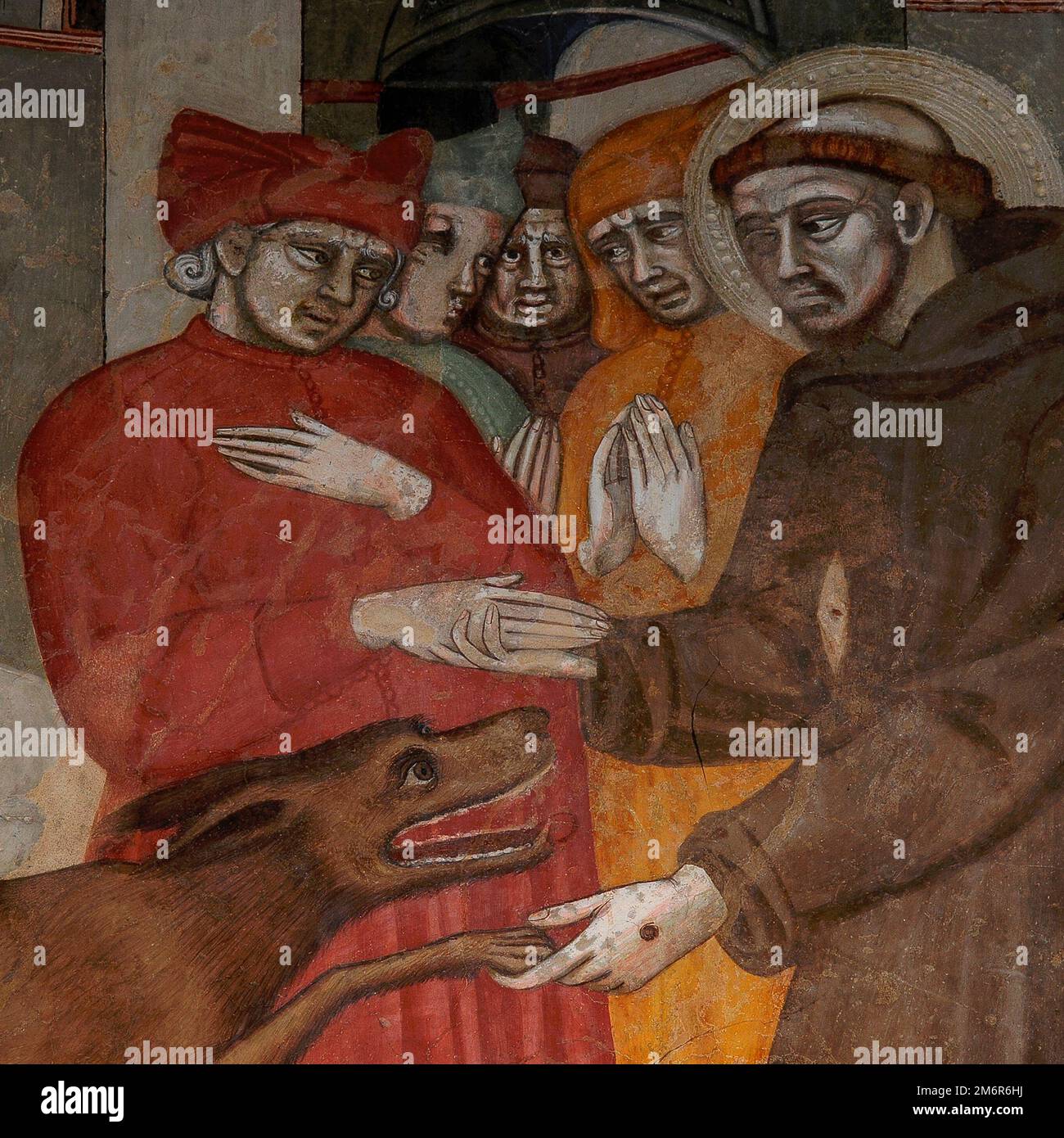 Franziskus von Assisi, schutzpatron der Tiere, zähmt den wilden menschenfressenden Wolf von Gubbio: Quadratisches Detail des Fresko 1380-Zyklus „Leben des Hl. Franziskus“ von den Malern der Sienese School Cristoforo di Bindoccio und Meo di Piero in der Chiesa di San Francesco oder der Kirche des Hl. Franziskus in Pienza, Val d'Orcia, Toskana, Italien. Stockfoto