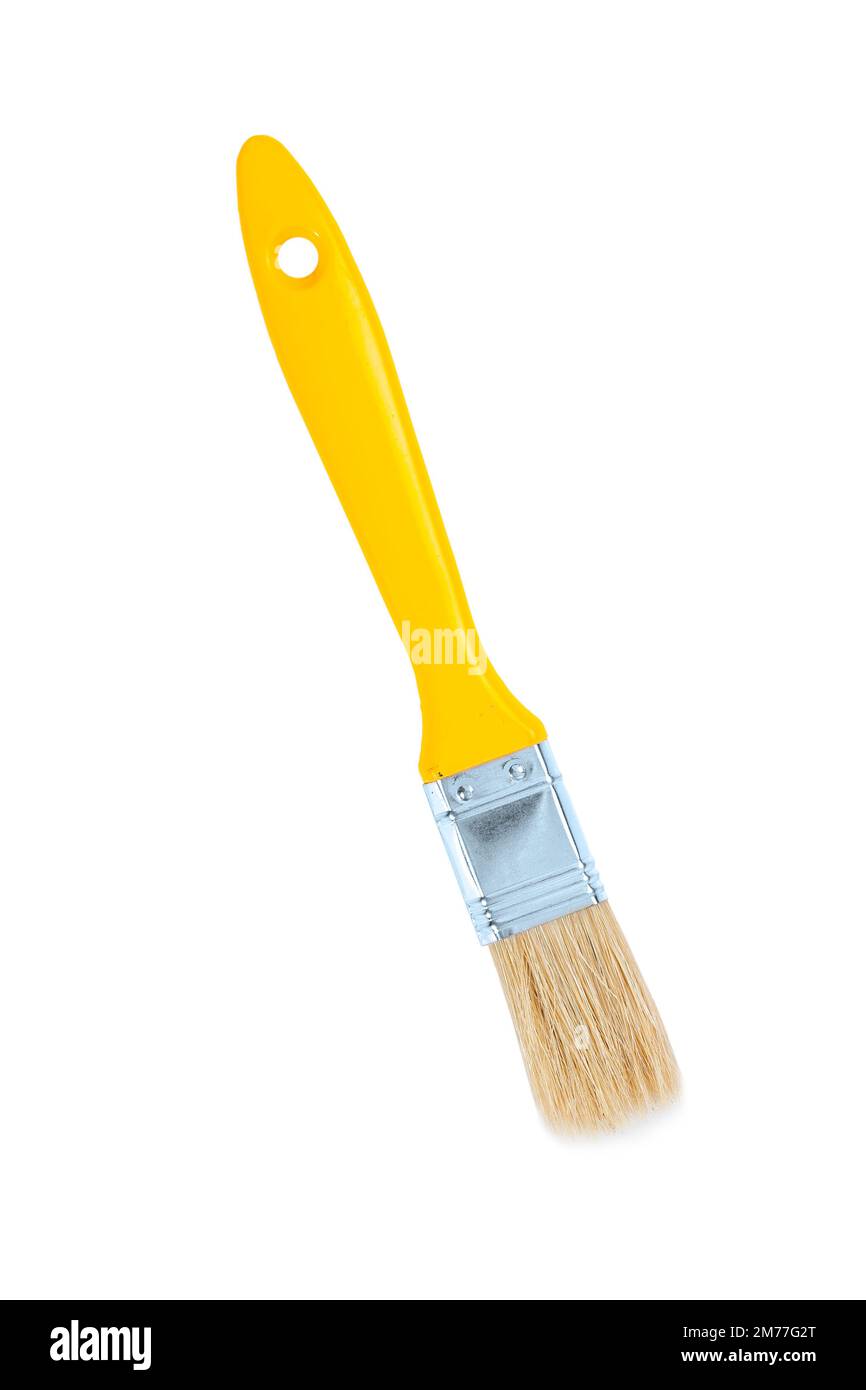 Kleiner gelber Pinsel isoliert Stockfoto