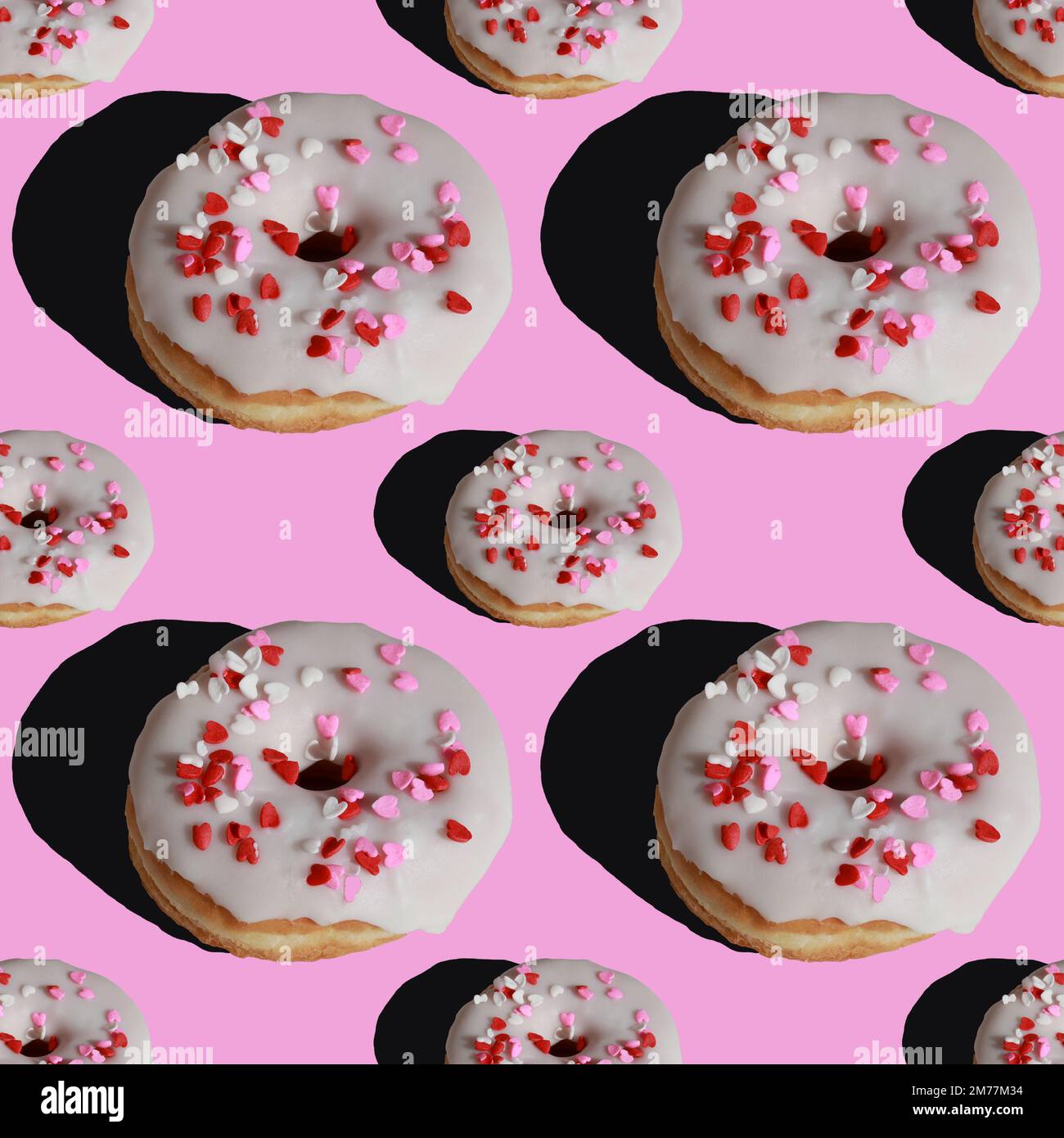Nahtloses Muster aus Donuts mit Zuckerglasur auf pinkfarbenem Hintergrund Stockfoto