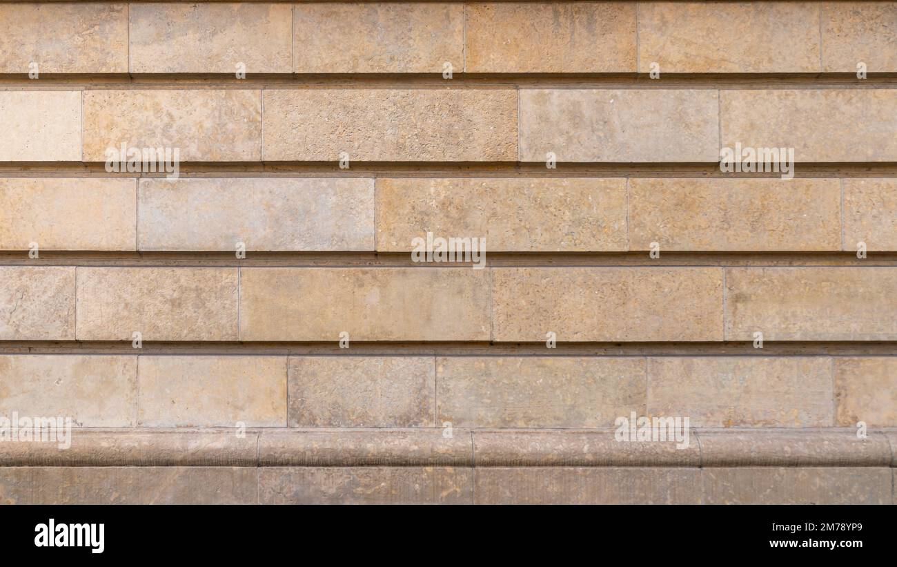 Dolomitsteinmauer. Rustikal. Architektonische Details Stockfoto