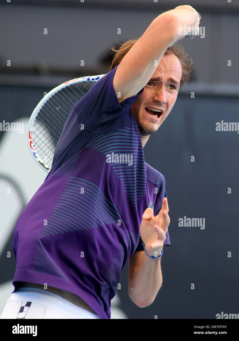 Russia's Daniil Medvedev makes a forehand return to his compatriot
