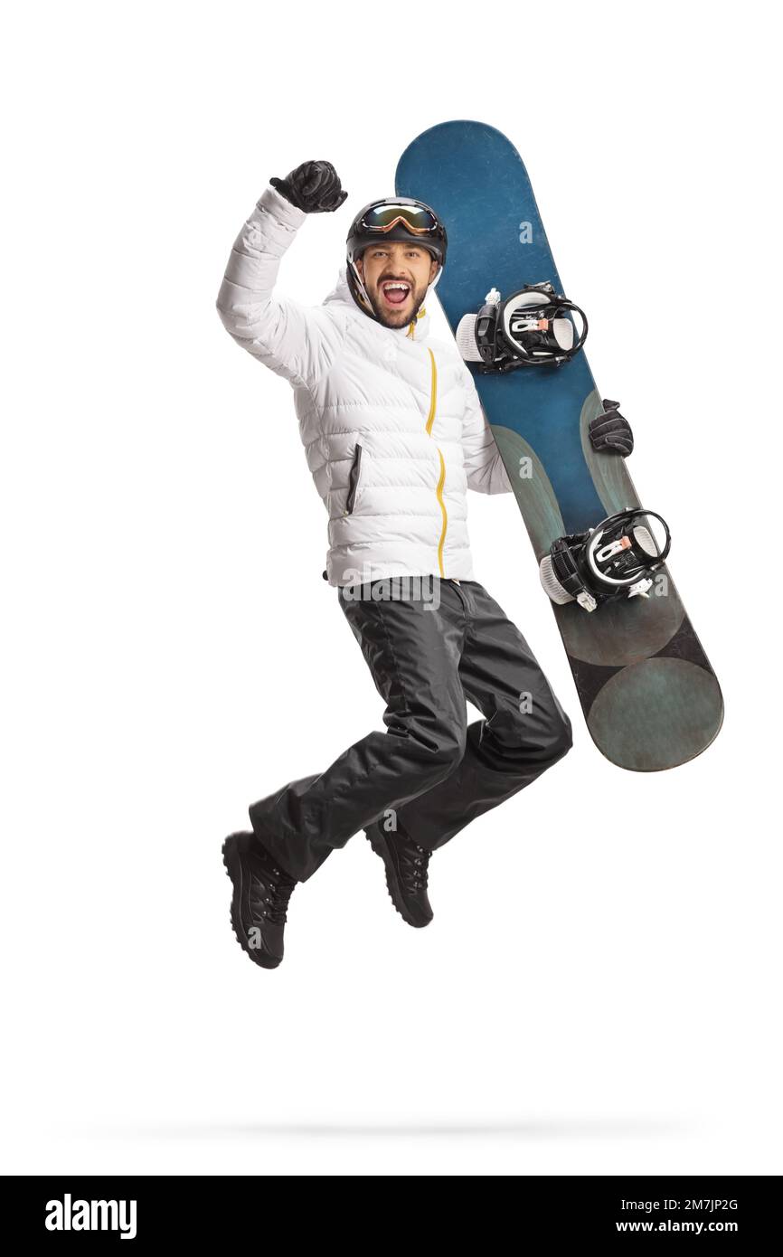 Glücklicher junger Mann mit einem Snowboard, der isoliert auf weißem Hintergrund springt Stockfoto