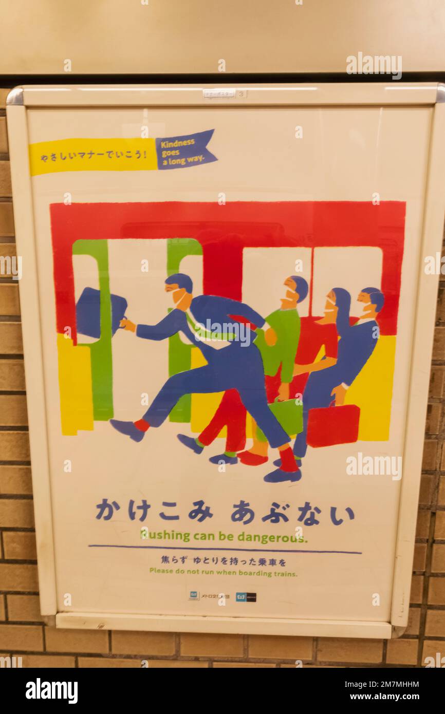 Japan, Honshu, Tokio, zweisprachiger Bahnhof Anti-Rushing-Schild Stockfoto